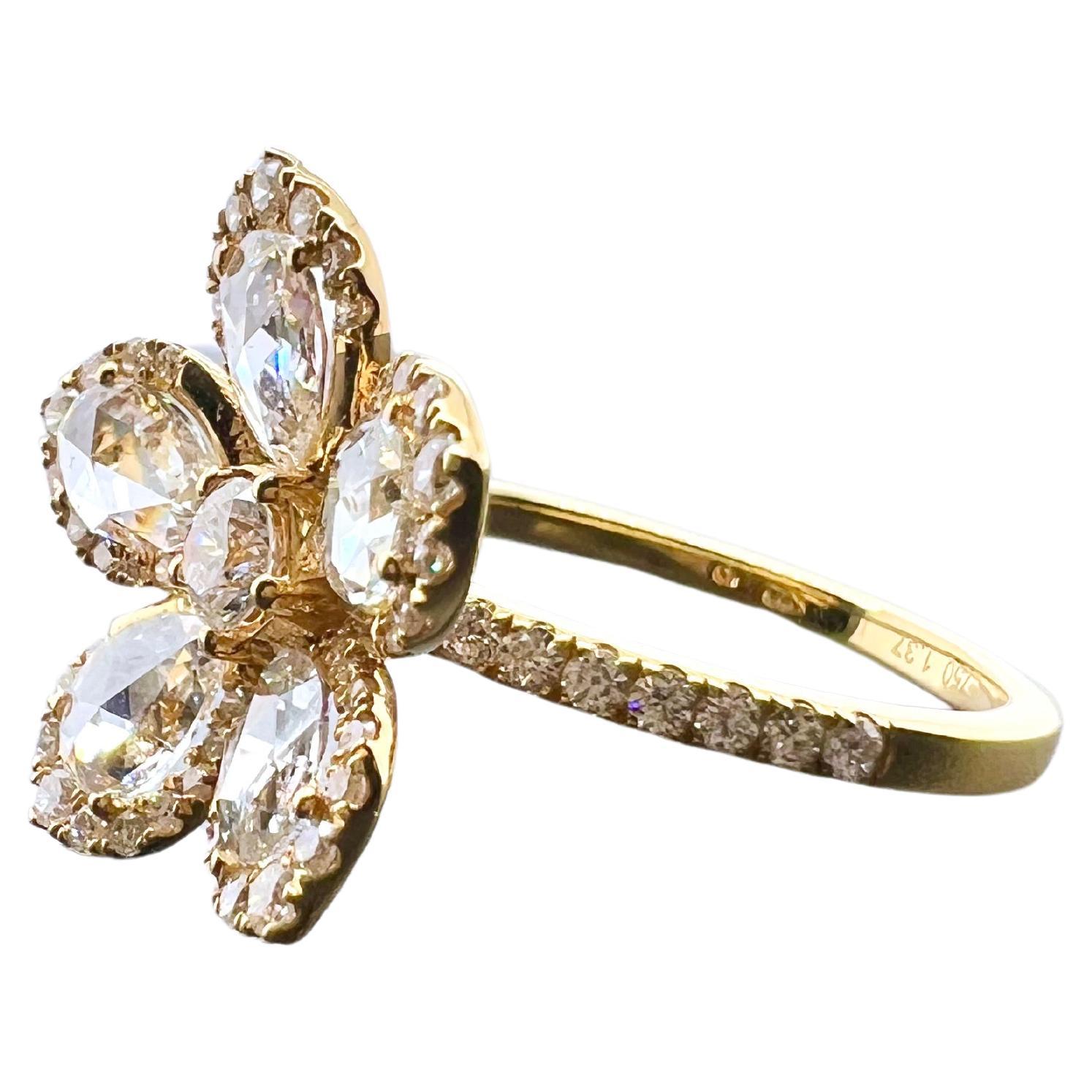 This ring is phenomenal. The flower petals are made up of rose cut diamonds! The round brilliant diamonds are set surrounding the frame but the focal eye candy will be on the gorgeous rose cut diamonds. These diamonds are not found commonly as it