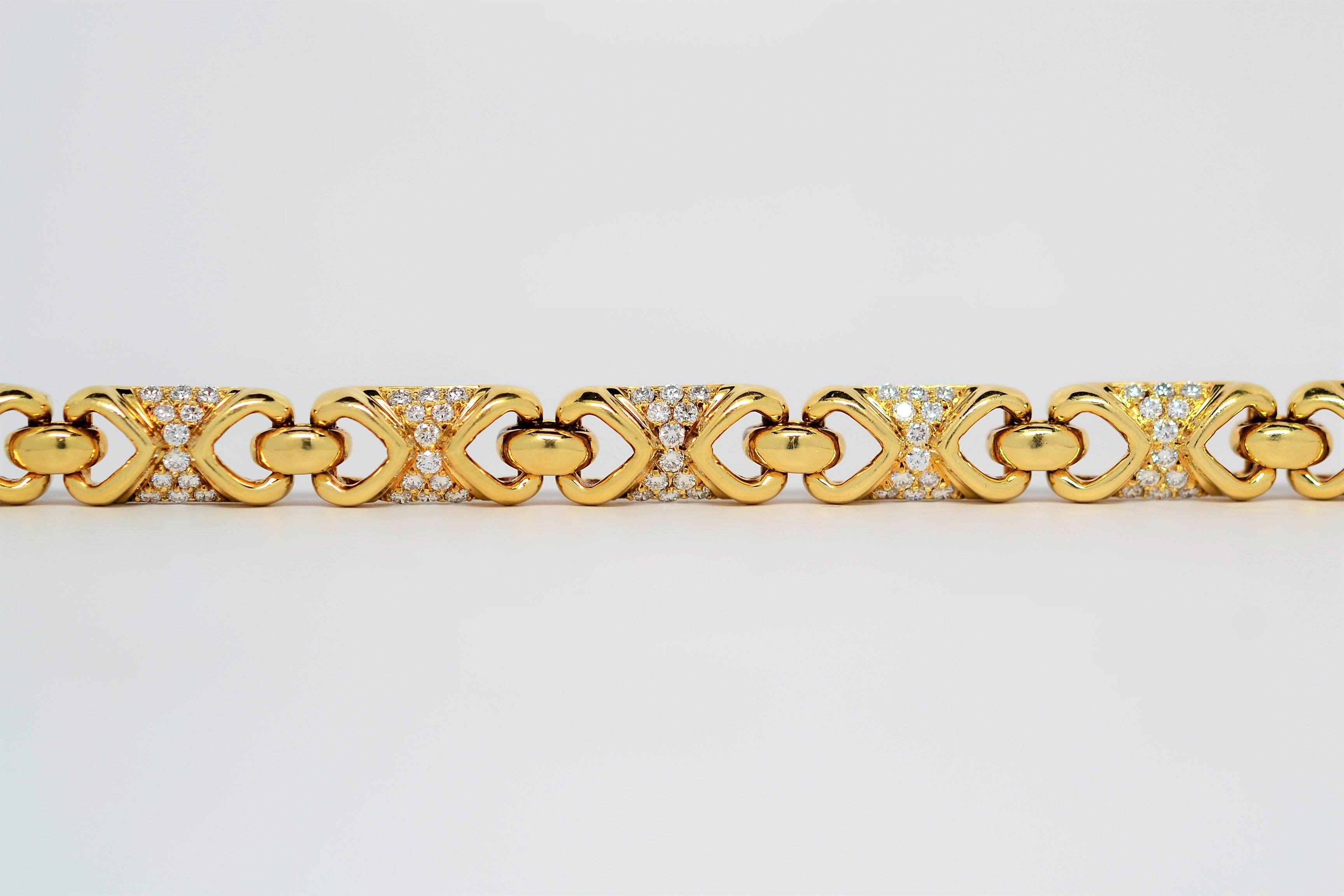 This custom made bracelet is set in 18K Yellow Gold using a multi-link layout with Round Brilliant Cut Diamonds. A traditional tongue and clasp for security with secondary lock. The bracelet measures 7