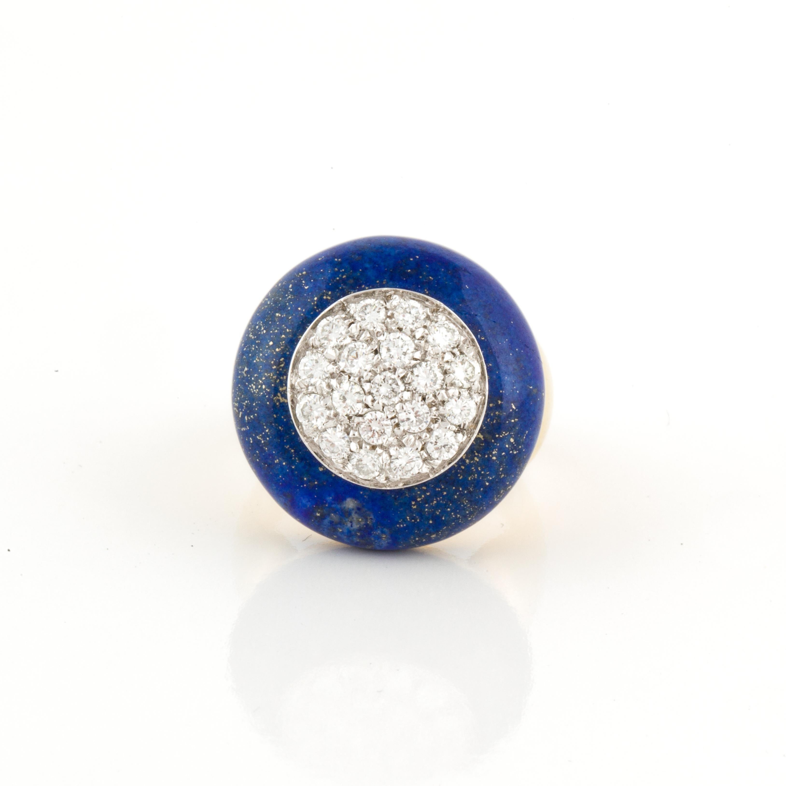 18K yellow gold ring featuring a lapis disc with pavé-set round diamonds in the center. There are 19 round diamonds that total 1.15 carats, G-H color and VS1-2 clarity.  The disc measures 13/16 inches across the top.    Ring is a size 7 3/4. Marked