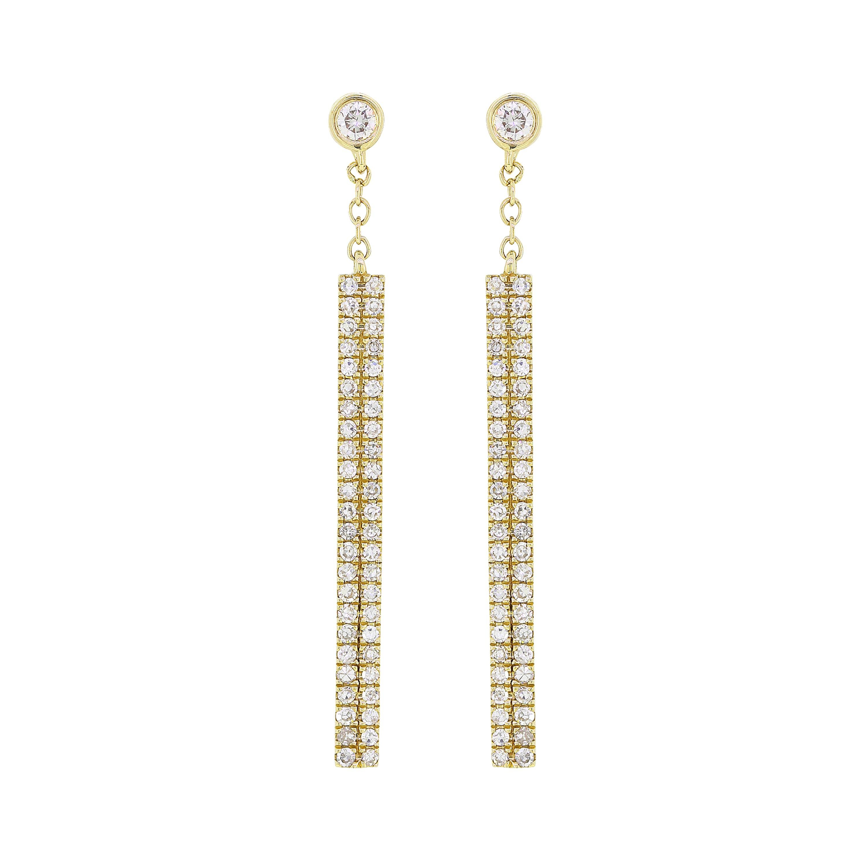 Rectangular drop earrings featured with 2 bezel set diamonds and 96 pave diamonds. The earrings come with gold posts and clutch backs.
Approx. Metal Weight: 2.22 gram
Approx. Diamond Weight: 0.31 Cts
Diamond Shape/Cut: Round
Diamond Color: