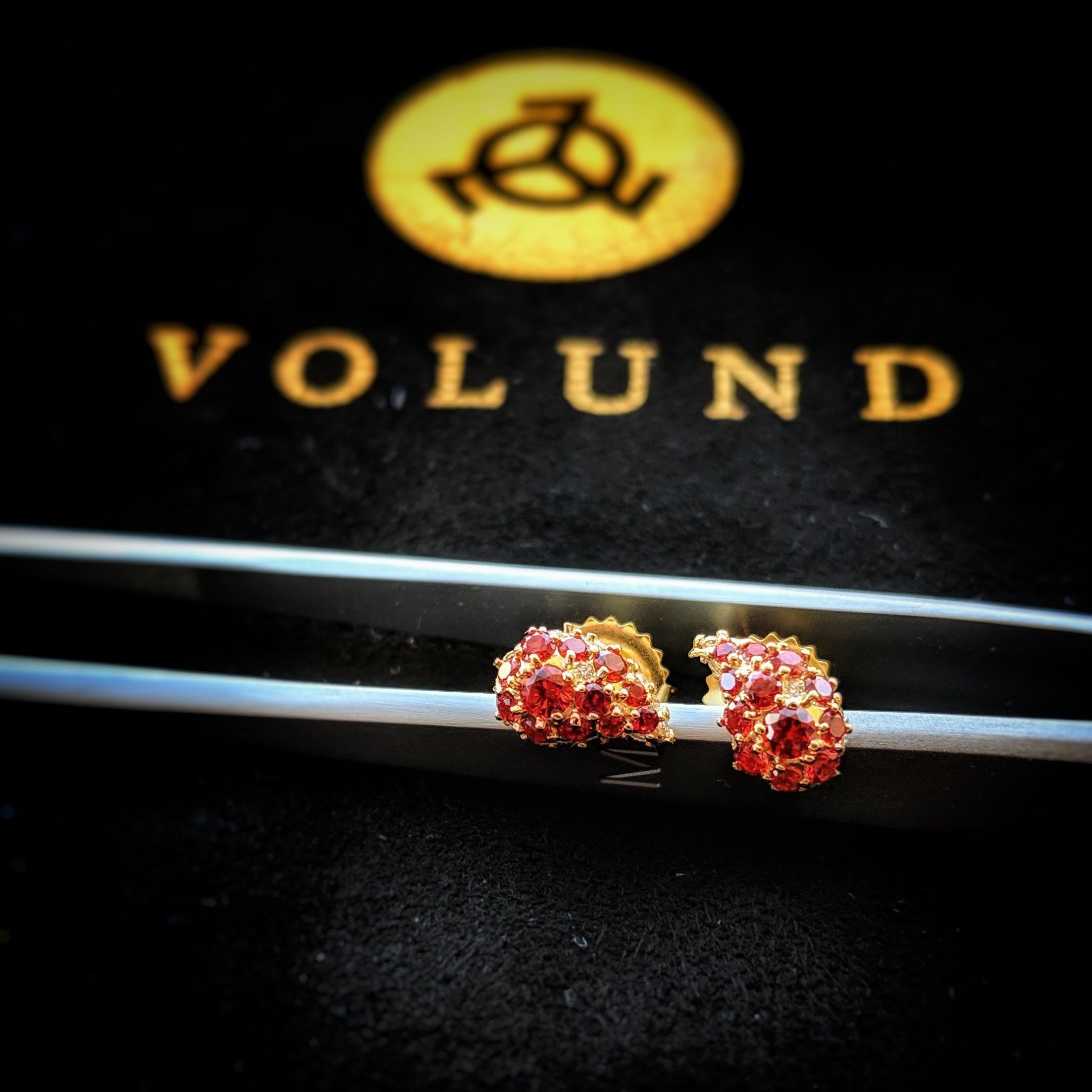 These stud earrings in 18K yellow gold are pave set with perfectly cut rubies and resemble the shape of a paisley or teardrop. Subtle and elegant, these exotic earrings are a fine example of high end designer jewel.

Long thought to depict the