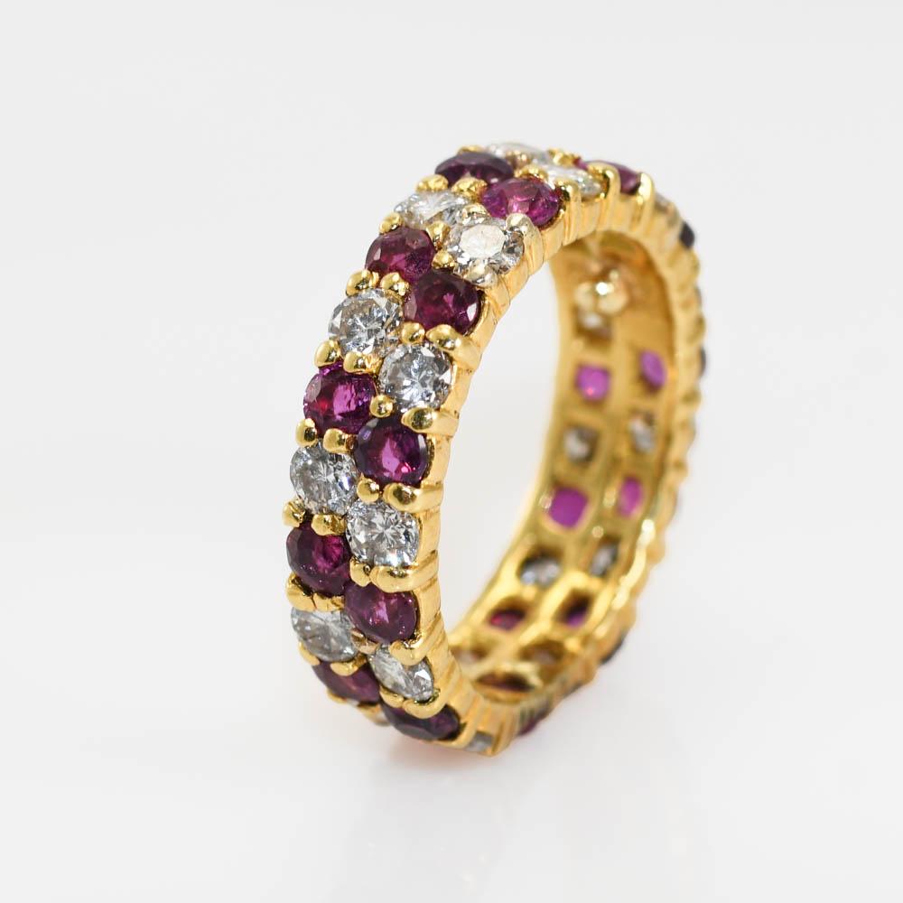 18KYG Ruby and Dia ring-5.3g, 1.00tdw
Ladies ruby and diamond ring in 18k yellow gold setting.
The ring tests 18k and weighs 5.3 grams gross weight.
The rubies are natural, round brilliant cuts, approximately 1.20 total carats.
The diamonds are