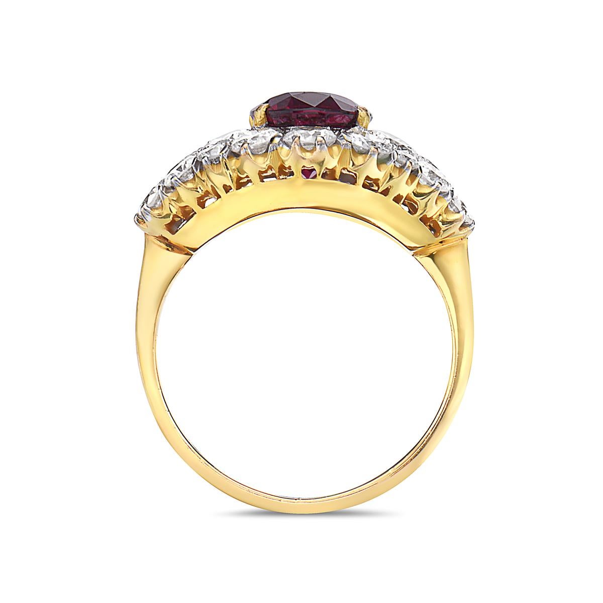 This ring features a 2.65 carat ruby center stone and 24 round brilliant diamonds weighing 2.50 carats set in 18K yellow gold. Made in Italy. Size 5 3/4.

Resizeable upon request.

Viewings available in our NYC showroom by appointment.