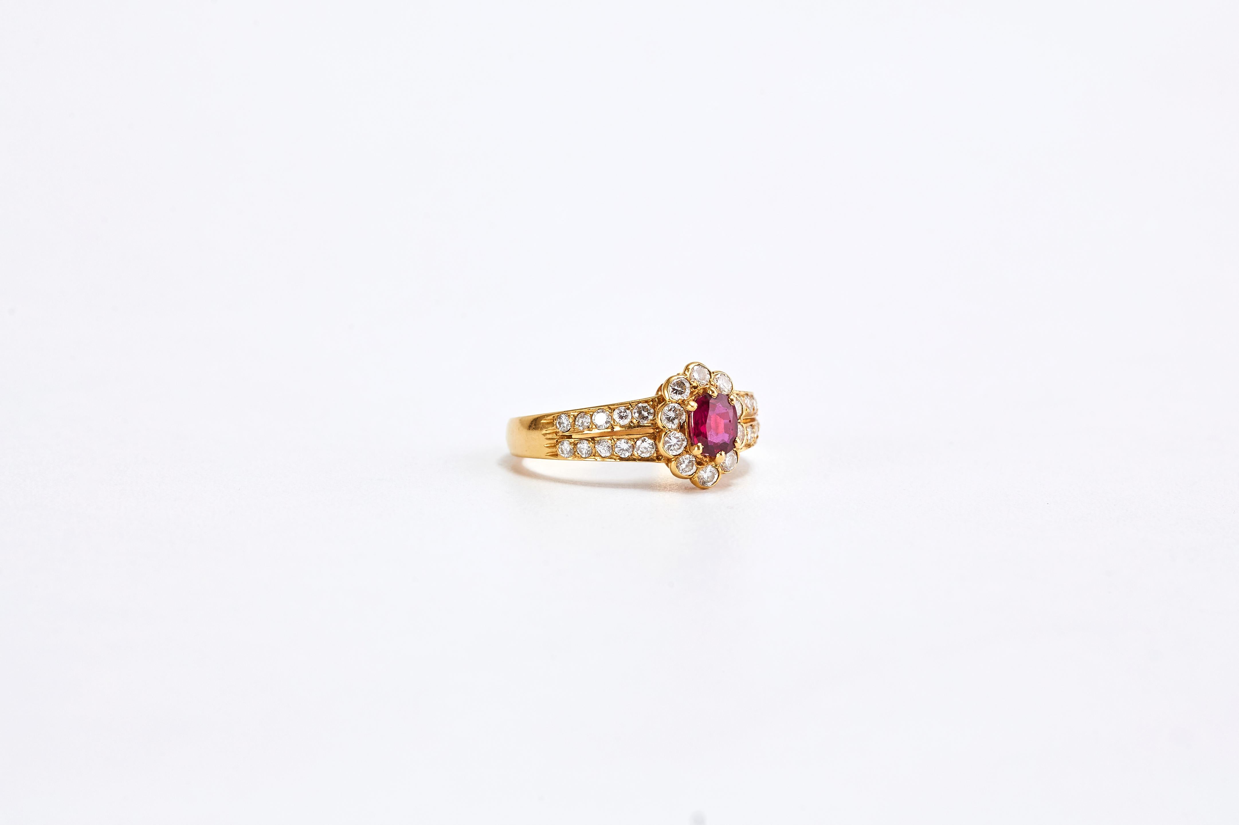 18k Yellow Gold Ruby and Diamond Ring

Gorgeous gold ring with a center stone ruby and side diamonds. Made in France in the 60s.
Ruby is oval cut 0.50 carat, Diamonds are a total of 1.10 carat.

Total Weight: 4.1 grams. Size: 6.5 US
