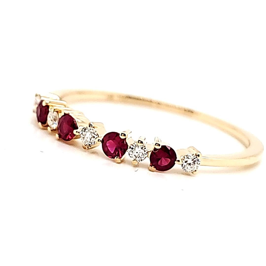 Seize the moment and declare your love with our Ruby Diamond Engagement Ring today.

Adorned with four round rubies totaling 0.18 carats and five round diamonds totaling 0.09 carats, set alternately in radiant 18K yellow gold weighing 1.18