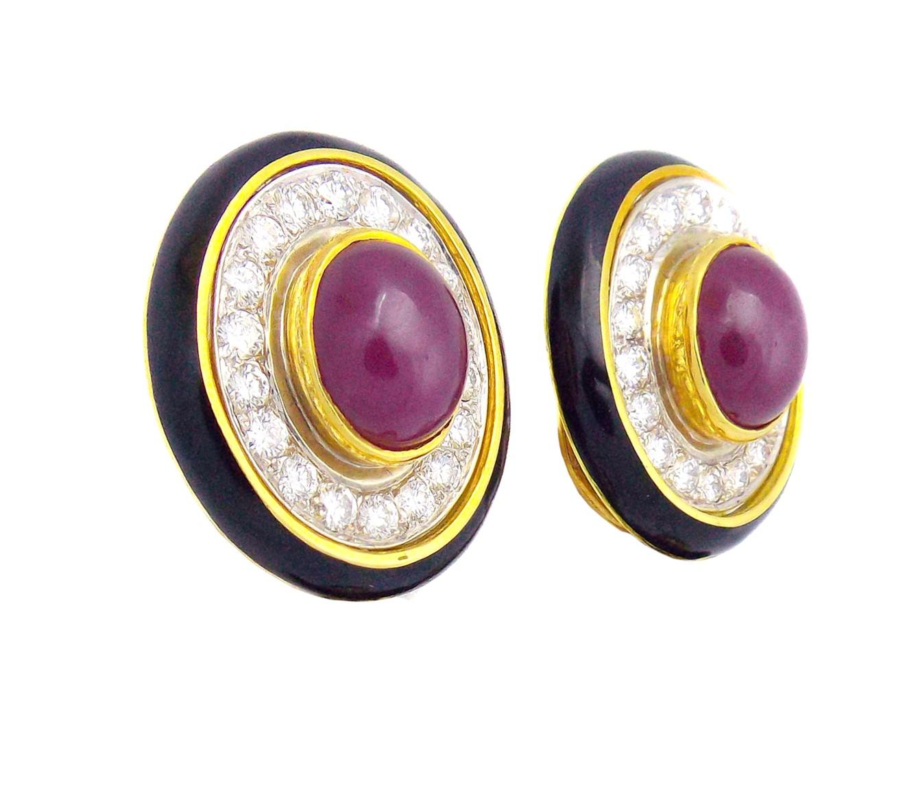 A pair of gold, ruby, diamond and enamel earclips, 
in an oval design with outer black enamel borders, the centers containing 36 round brilliant cut diamonds weighing approximately 1.70 carats total and two oval cabochon cut rubies measuring