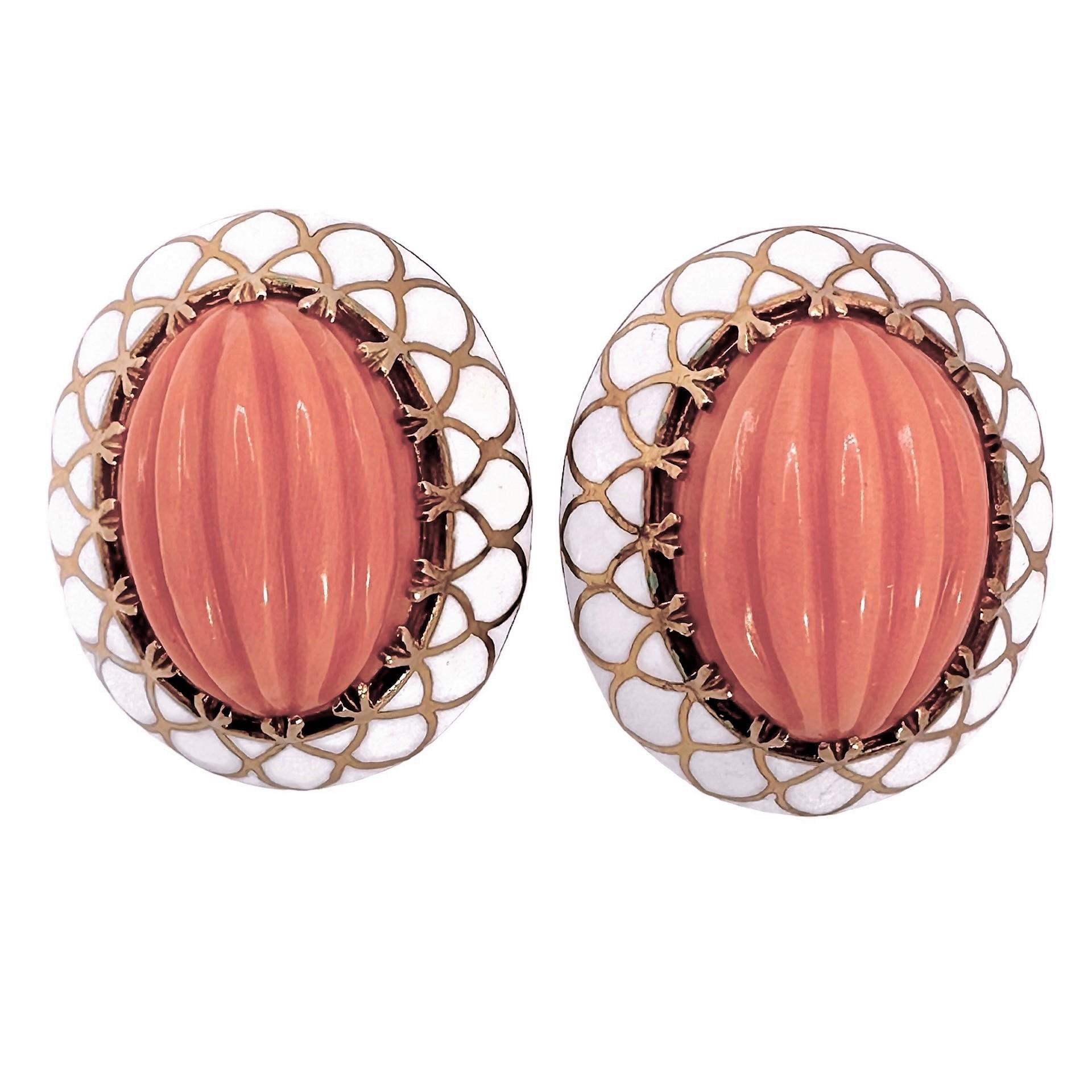 This lovely pair of Mid-20th Century 18k yellow gold fashion earrings are ideal for summer! They have a light and airy feel about them. The delicately fluted coral cabochons, each measuring 3/4 inches by 9/16 inch, are a velvety salmon color. 