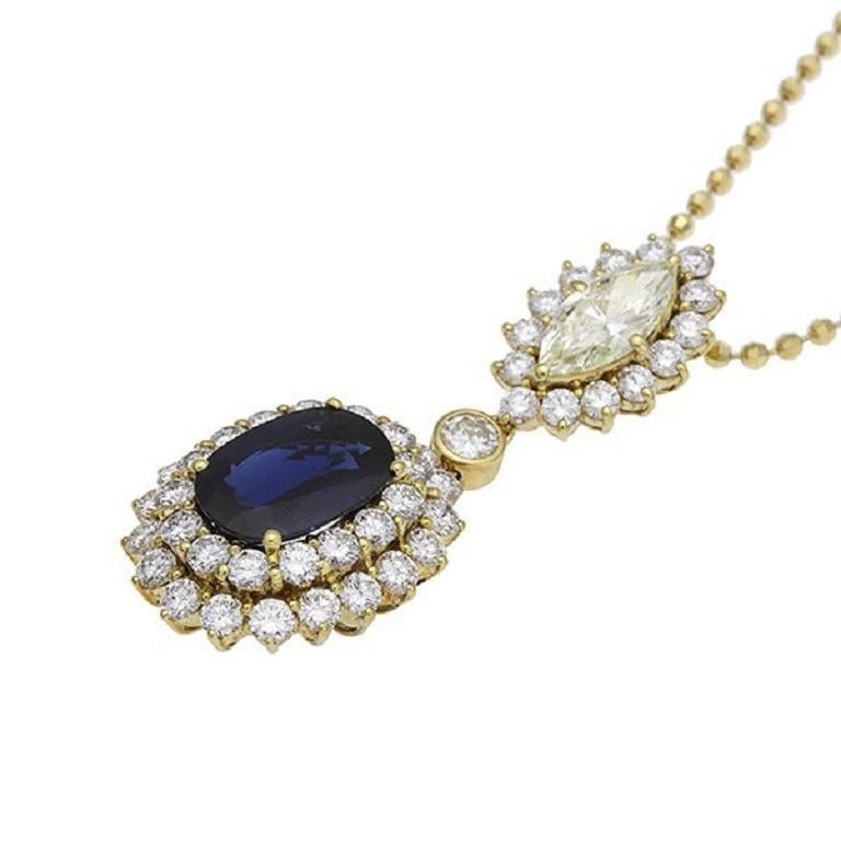 Elevate your style with our stunning sapphire pendant, adorned with a mesmerizing 5.8ct sapphire and dazzling diamonds. Divided into three distinct sections—featuring a sapphire setting, a round brilliant cut diamond, and a marquise cut diamond—this