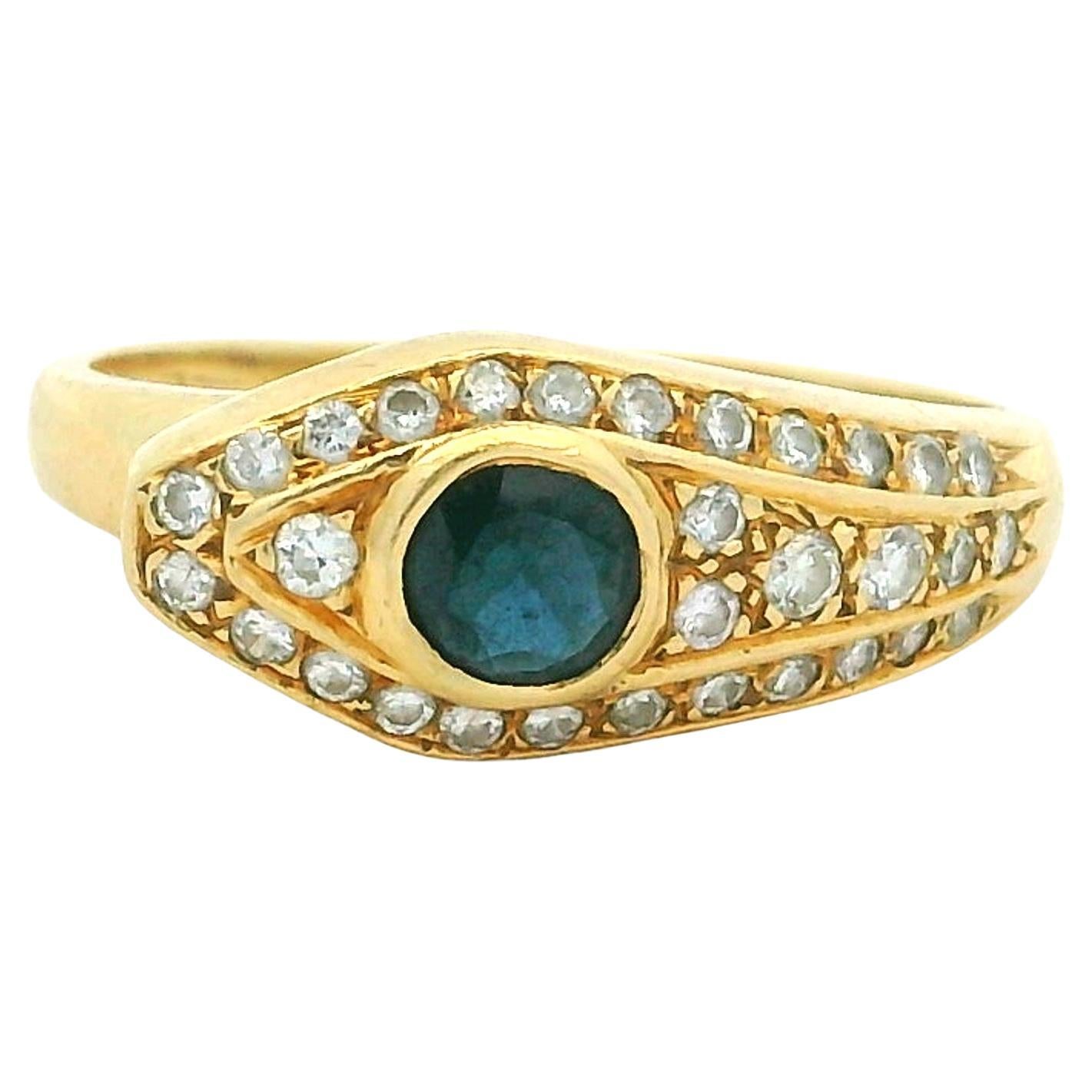 Schlangenring mit Saphir und Diamant aus 18 Karat Gelbgold, Böses-Auge-Motiv