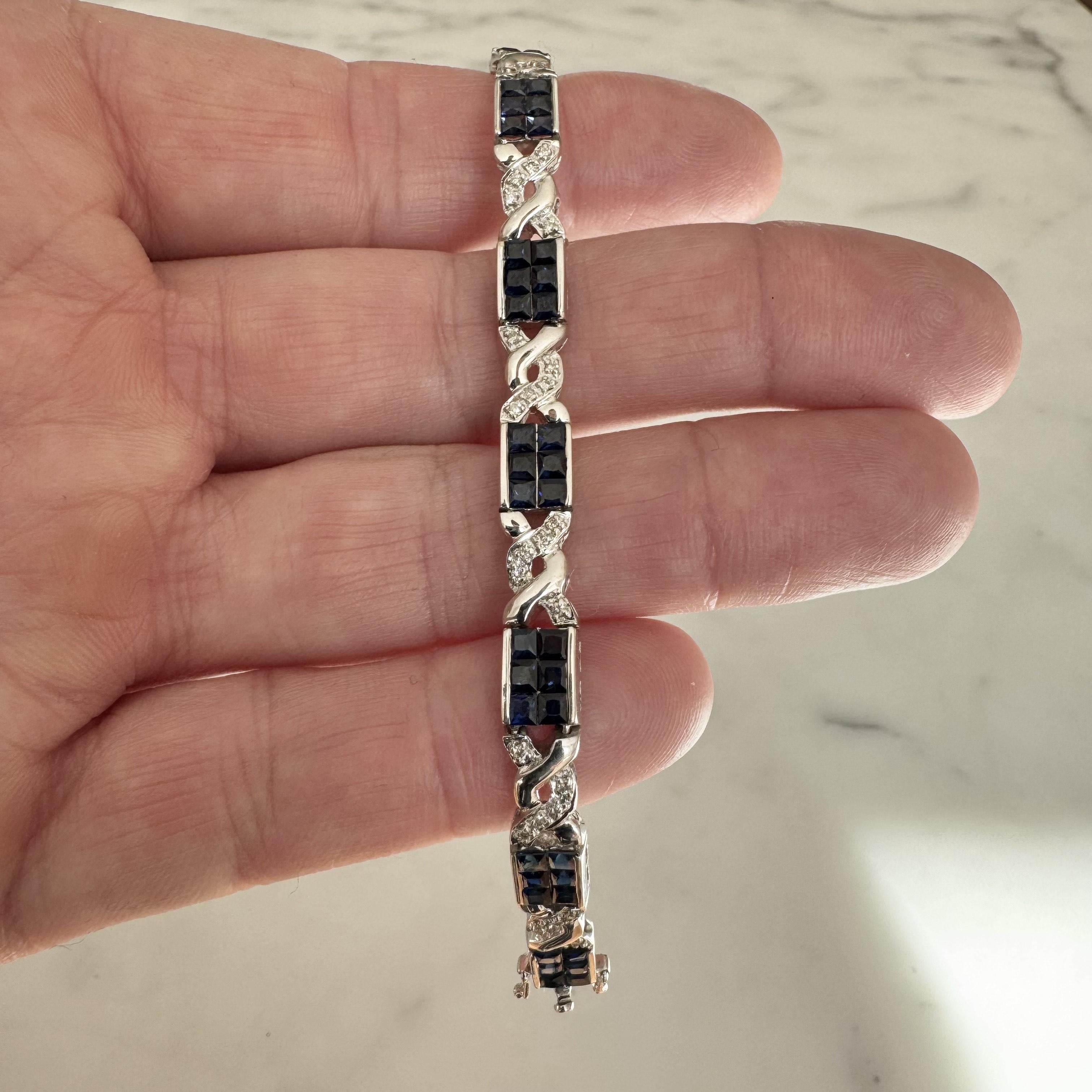Condition:  Excellent Condition, Professionally Cleaned and Polished
Metal:  14k Gold (Marked, and Professionally Tested)
Weight:  18.4g
Gemstones:  Blue Sapphires
Diamonds:  Round Cut Natural Diamonds 0.50cttw
Length:  7