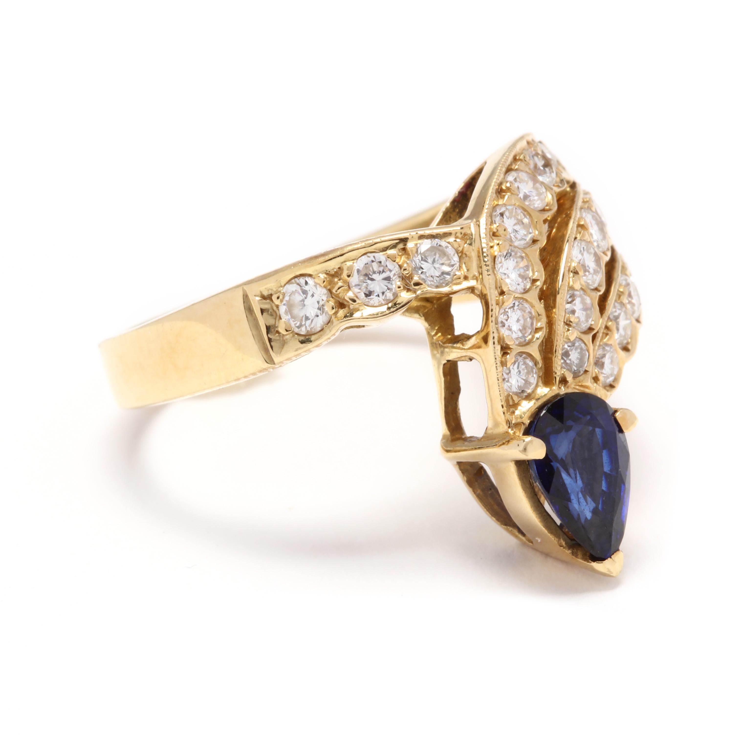 An 18 karat yellow gold, sapphire and diamond cocktail ring. In a bypass style design with a scalloped, single and triple row of full cut diamonds weighing approximately .81 total carats leading to a prong set, pear cut sapphire weighing