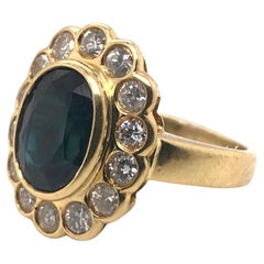 18 Karat Gelbgold Halo-Ring mit Saphir und Diamant