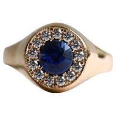 Anello aureola con zaffiro e diamante in oro giallo 18K