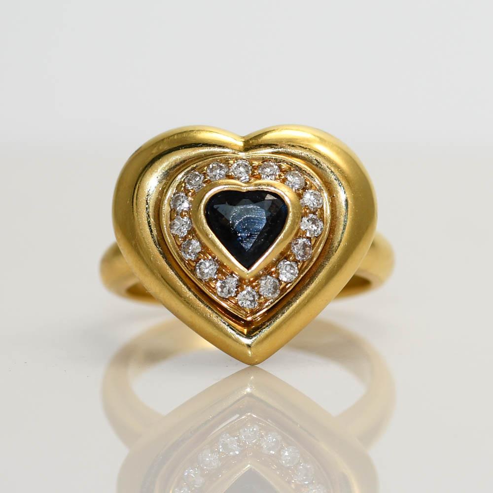 Ladies 18k yellow gold, diamond and blue sapphire ring. 9.8grams.
There is 0.30ct of round brilliant diamonds, VS clarity, G color.
The blue sapphire is heart shaped, 0.50ct
Size 7 