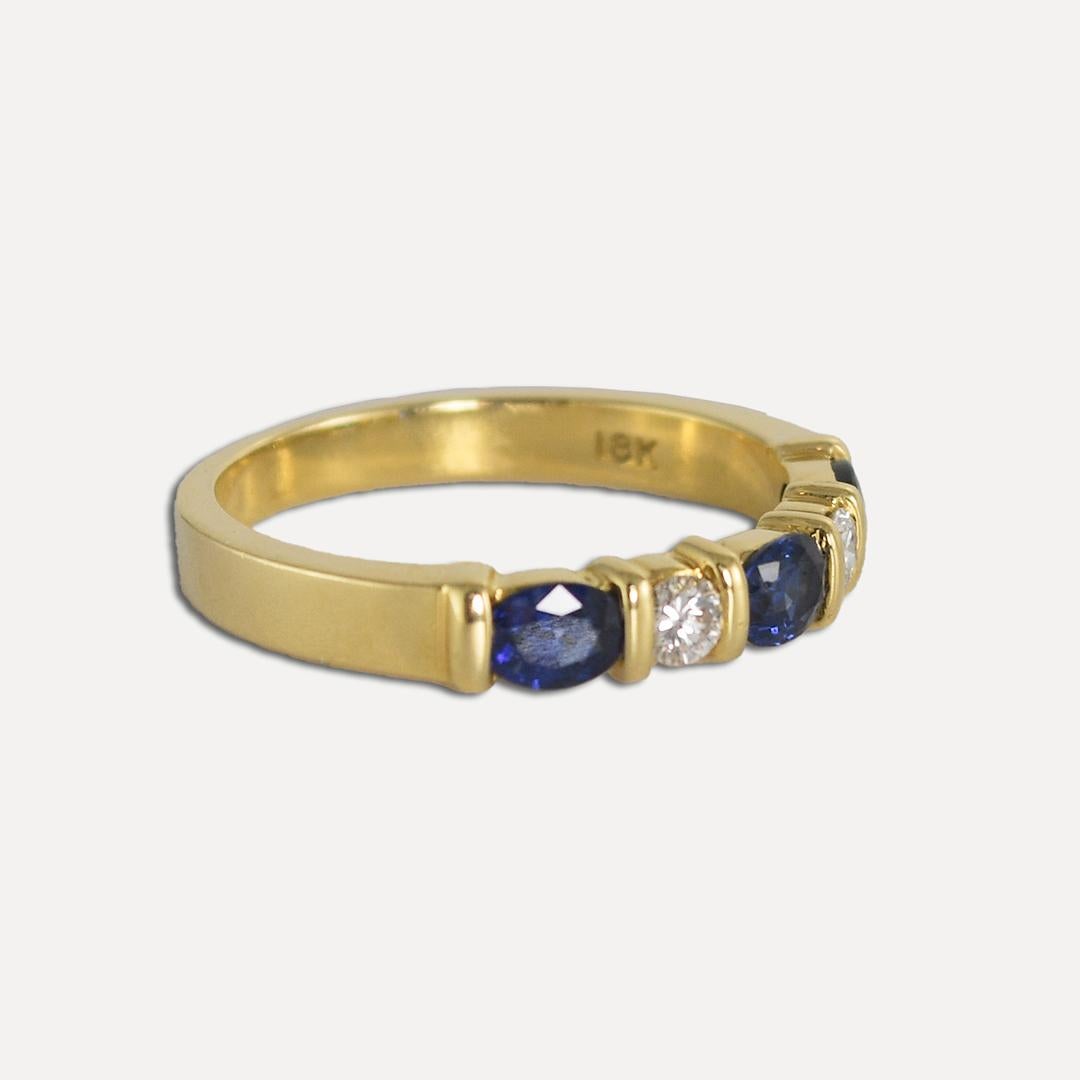 Ladies sapphire and diamond ring in 18k yellow gold mounting.
Stamped 18k and weighs 3.4 grams gross weight.
The blue sapphires are dark blue and oval shaped, .30 total carats.
The diamonds are round brilliant cuts, H, i, j color range, Vs