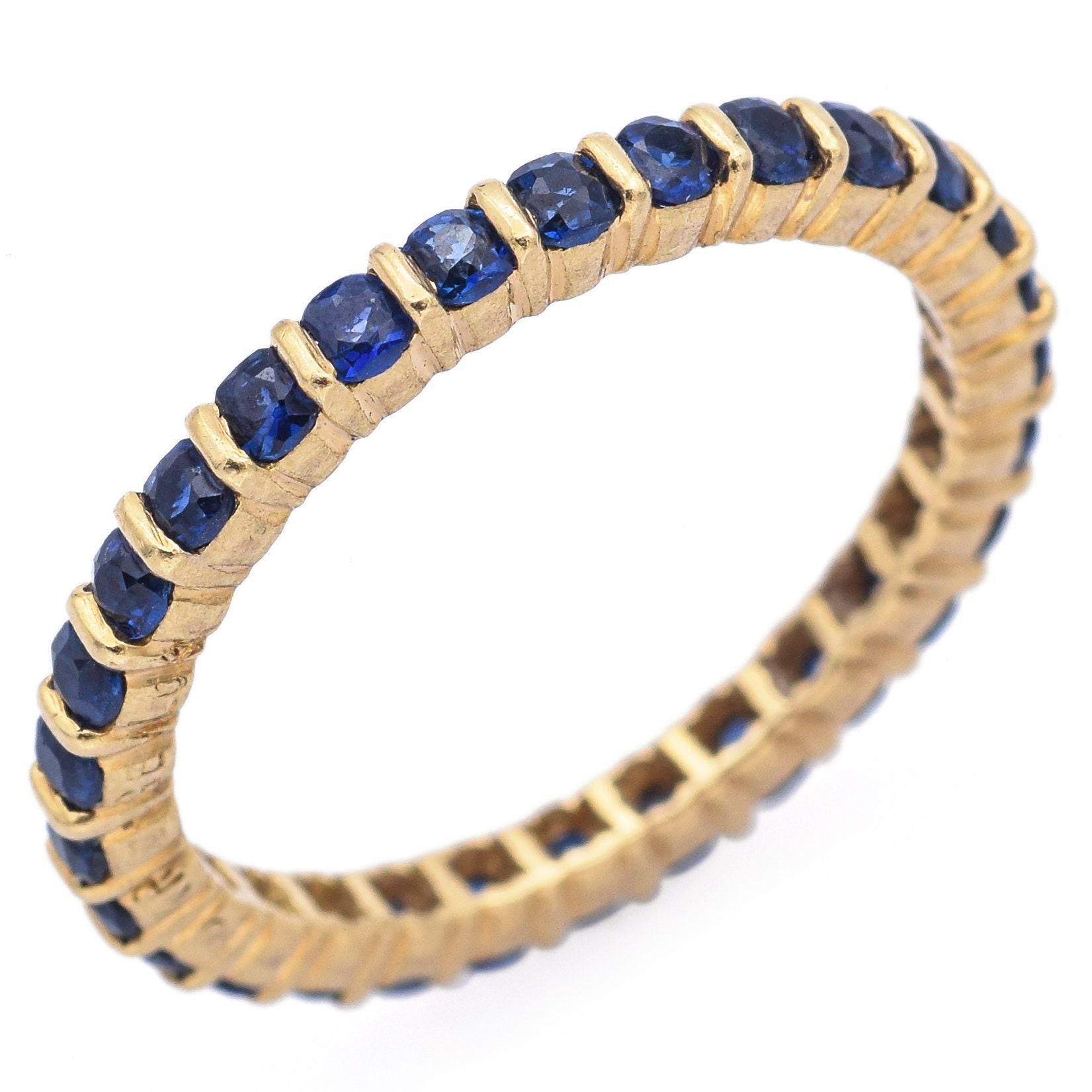 Weight: 2.1 Grams
Stone: Sapphire (1.5 mm)
Measurements: 2 x 21 x 2.35 mm
Ring Size: 5.75
Metal: 18k Gold

Item #:BR-1181-020924-10
