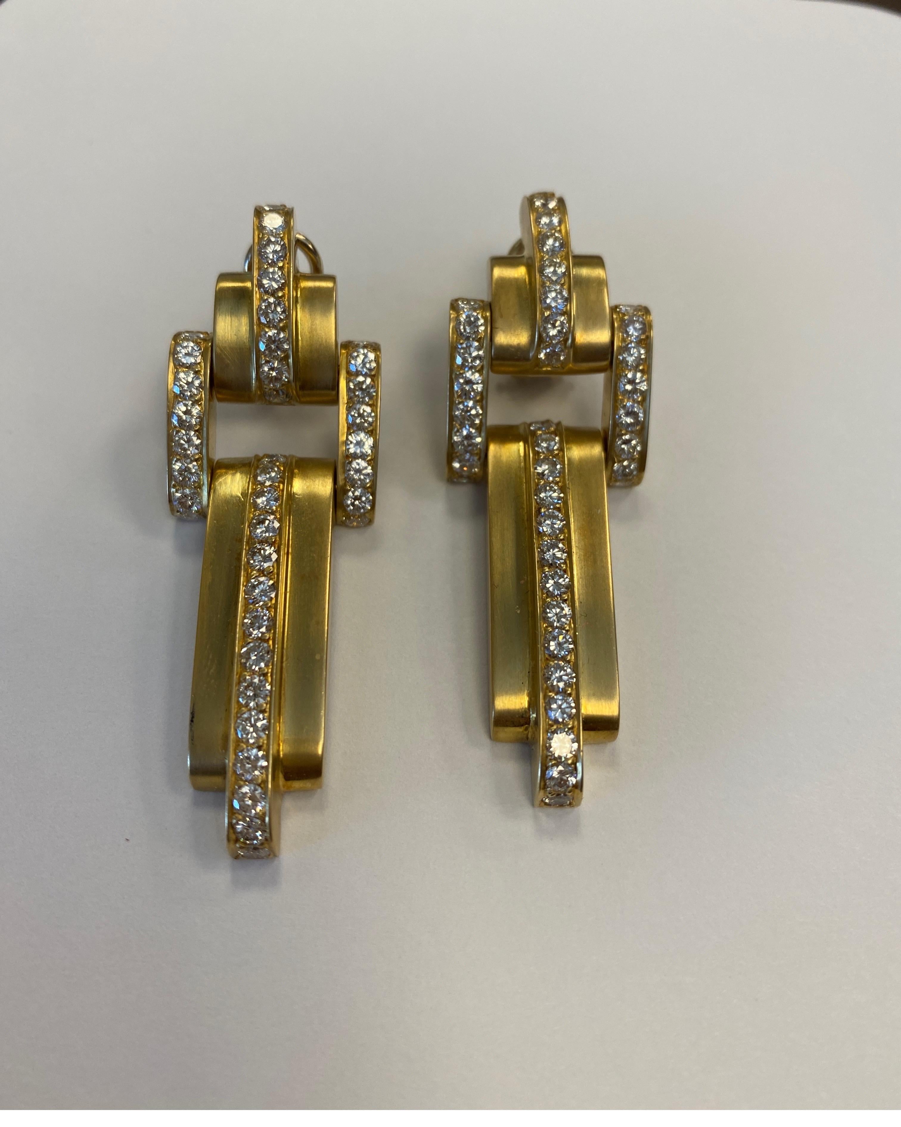 18K yellow gold drop earrings by Susan Berman, satin finish, flexible, set with 78 full cut round diamonds weighing 4.35 cts
retail $11,500