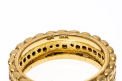 Anneau d'éternité en or jaune 18 carats à motifs de volutes et diamants