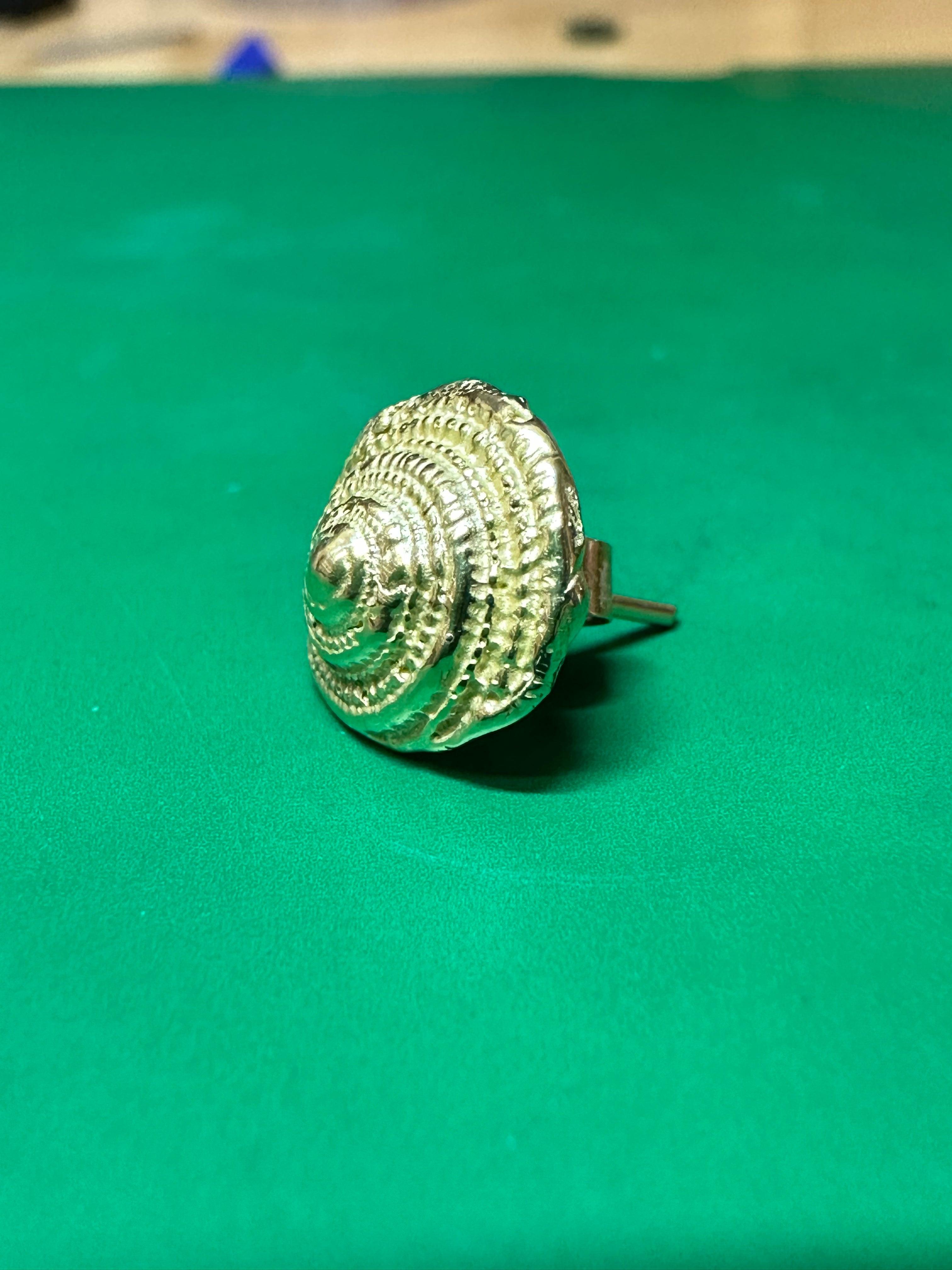 A stunning 18ct Yellow Gold Stud which is a copy of a real sea snail chic and elegant design but also lightweight it will offer a touch of sophistication and summer while it is comfortable for everyday wear. 

This versatile stud can be beautifully