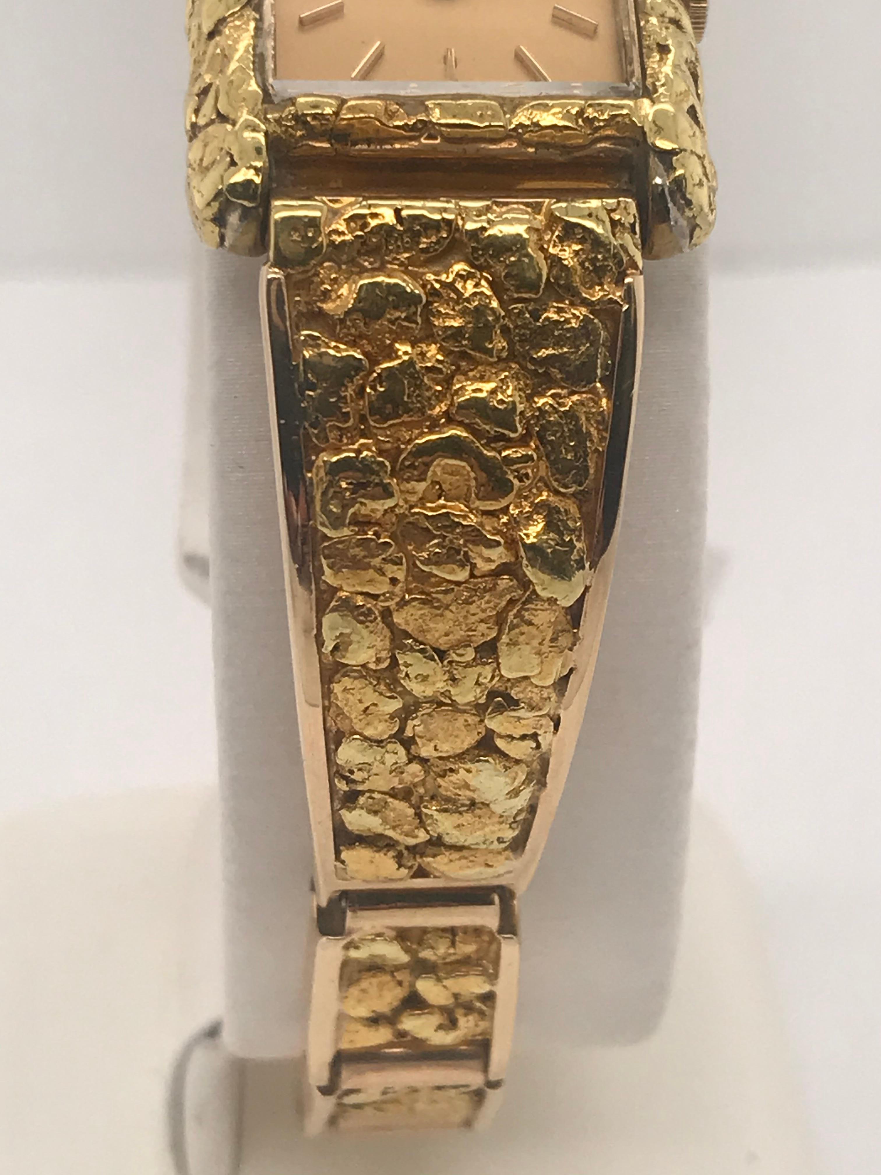 This Seiko watch is for sure a different timepiece like no other.  It's a blast from the past with square link style bracelet and has 18k yellow gold nuggets that are gracefully inlaid on a 10k gold frame.  It is 7 inches in length and has a fold