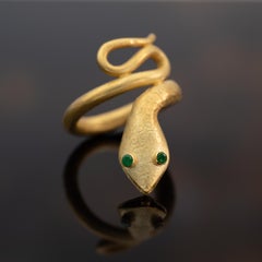 Schlangenring aus 18K Gelbgold mit Smaragd-Augen