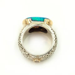 Anello con diamante e opale nero in argento e oro giallo 18 carati