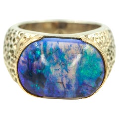 Anillo de diamantes con ópalo negro de plata y oro amarillo de 18 quilates