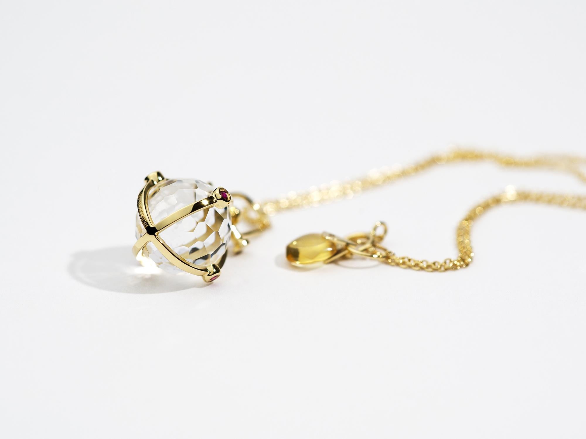 Rebecca Li designs sacred and mindfulness jewelry.

This elegant talisman pendant is from her Crystal Orb. The main design element used here is the sacred geometry circle. It represents oneness.

This beautiful 18K gold pendant is a talisman for