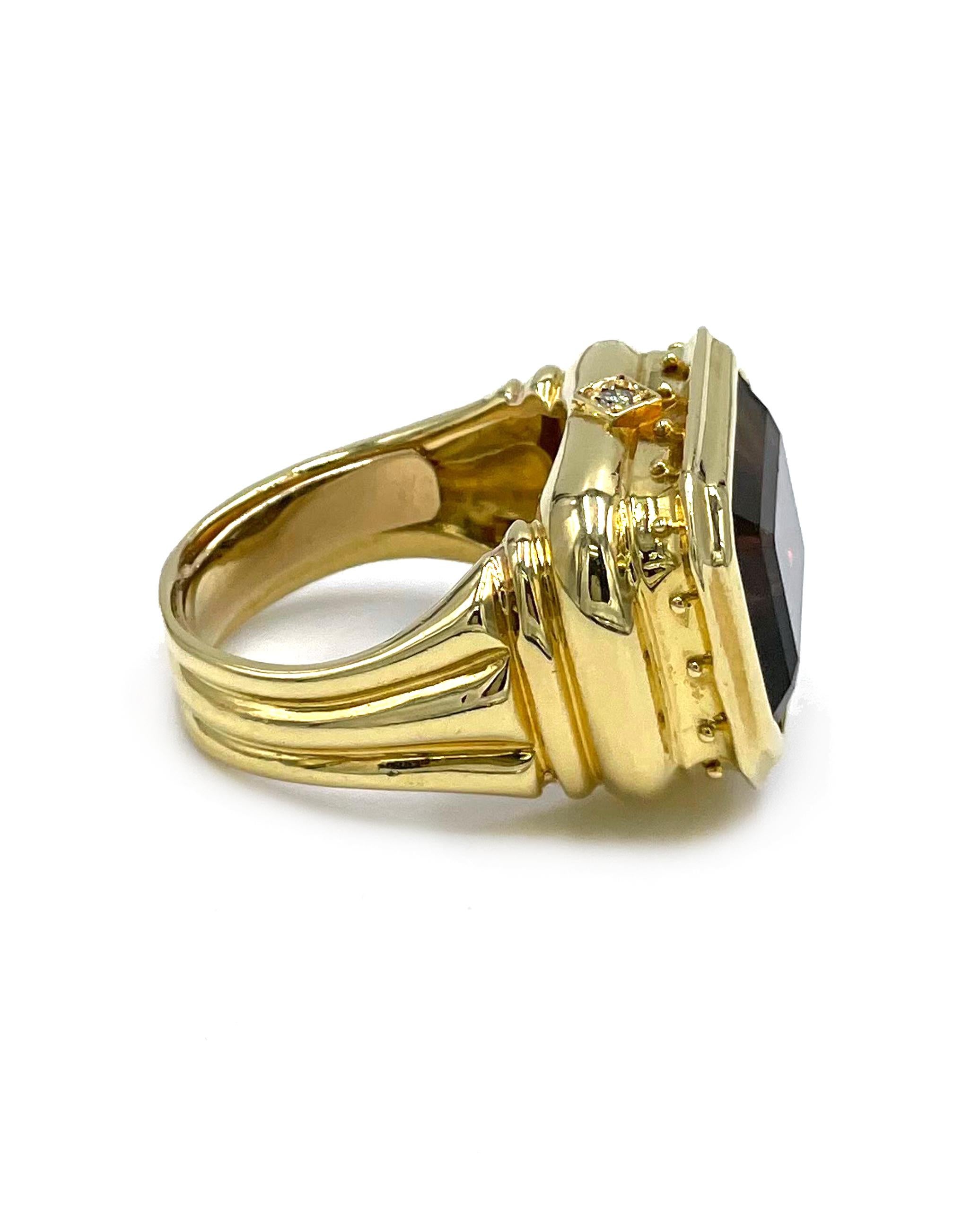 Circa 1990s. 18K yellow gold right hand ring with one emerald cut smoky topaz measuring approximately 15.00mm x 11.85mm and two round diamonds weighing approximately 0.03 carat.

- Slight wear and tear 
- Finger size 8
- Ribbed detailing through