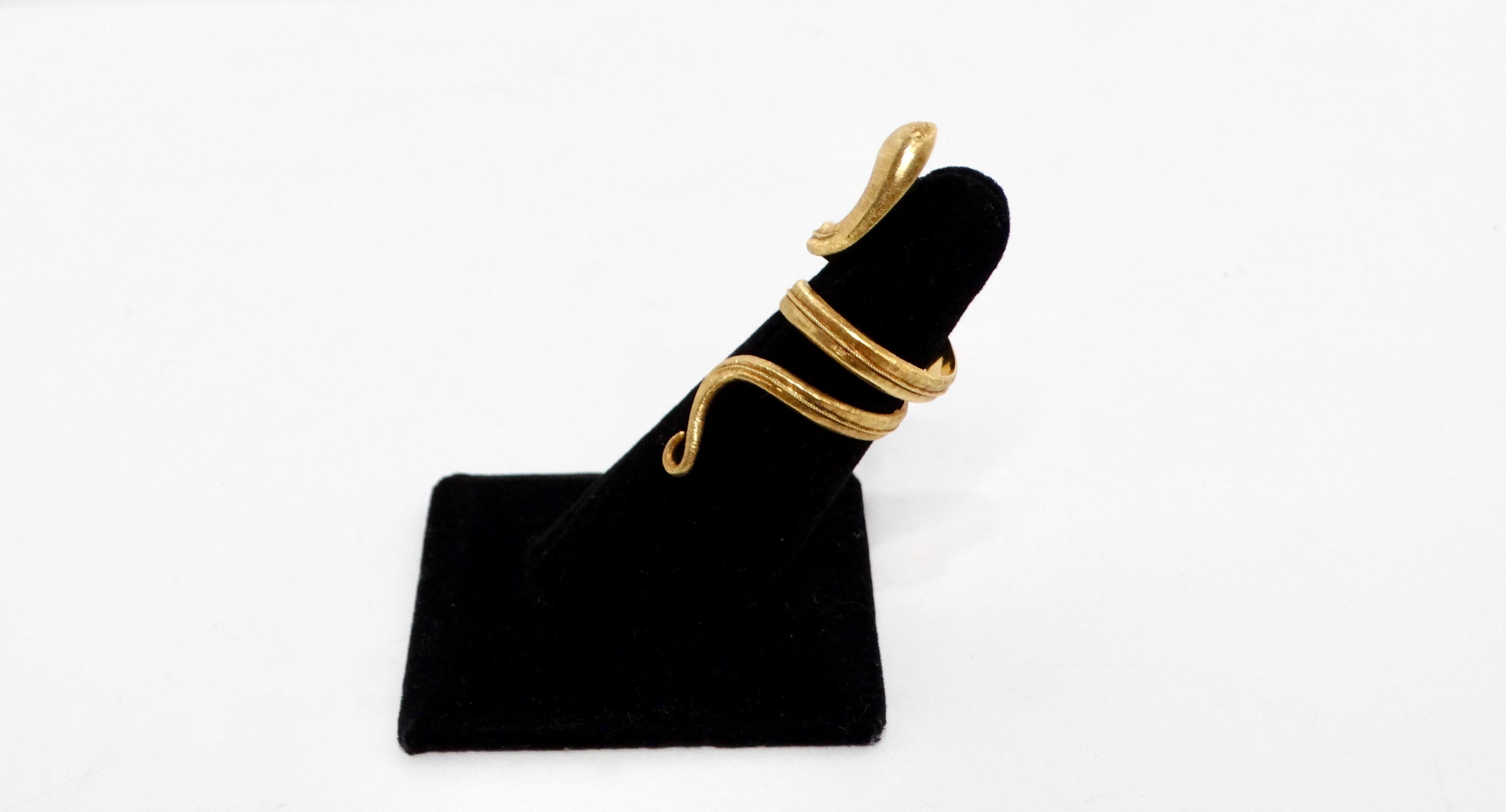 Introducing the stunning 18K Yellow Gold Snake Wrap Ring, a captivating piece that brings a touch of nature-inspired elegance to any jewelry collection. Crafted from luxurious 18k yellow gold, this ring features a serpentine design that gracefully