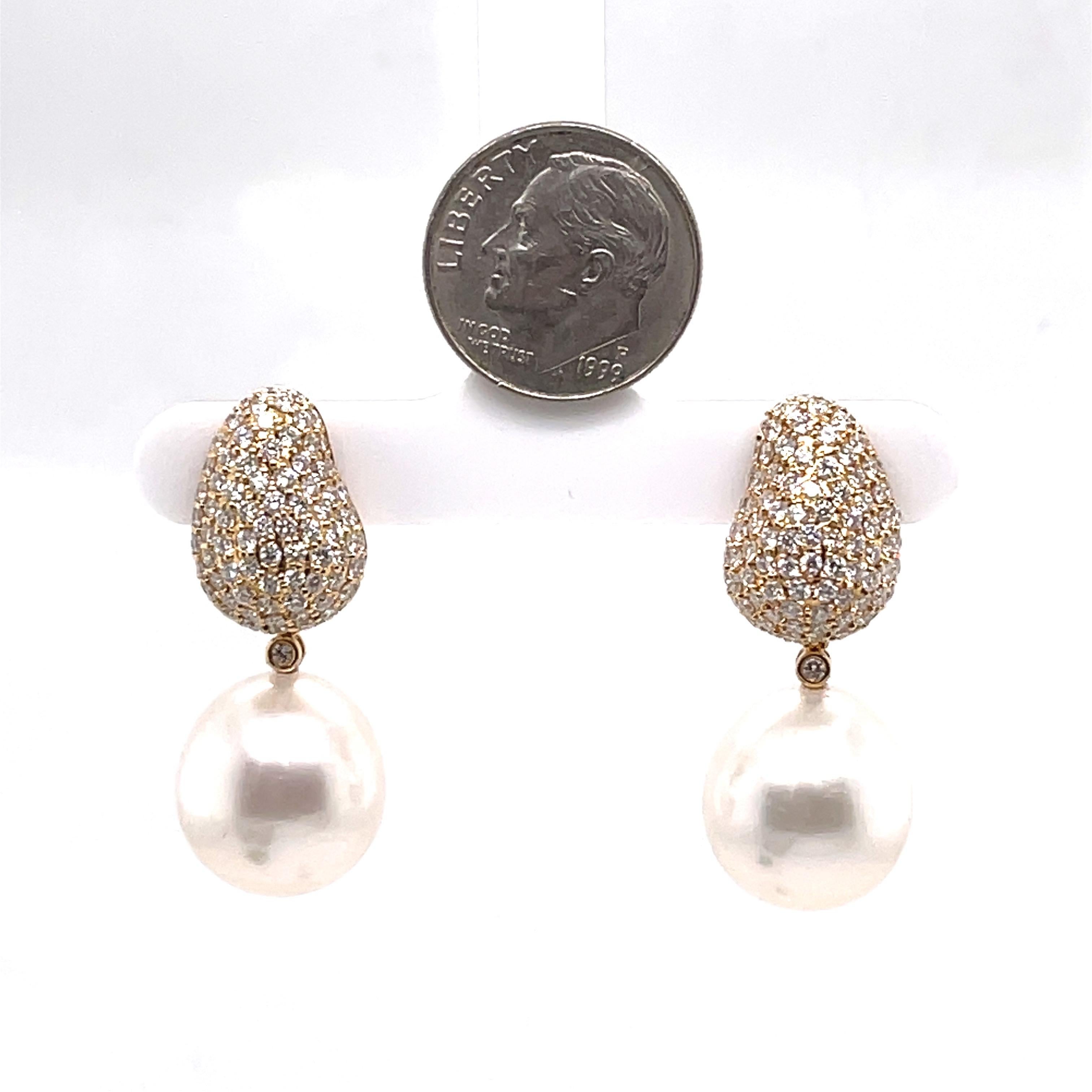 Push Back Post
2.32 Carat Diamonds
Can be worn as a drop earing or cluster diamond stud.
Pearl is Detachable.
18K Yellow Gold 
Measurements without pearl attachments:  16mm in length 11.2 width
