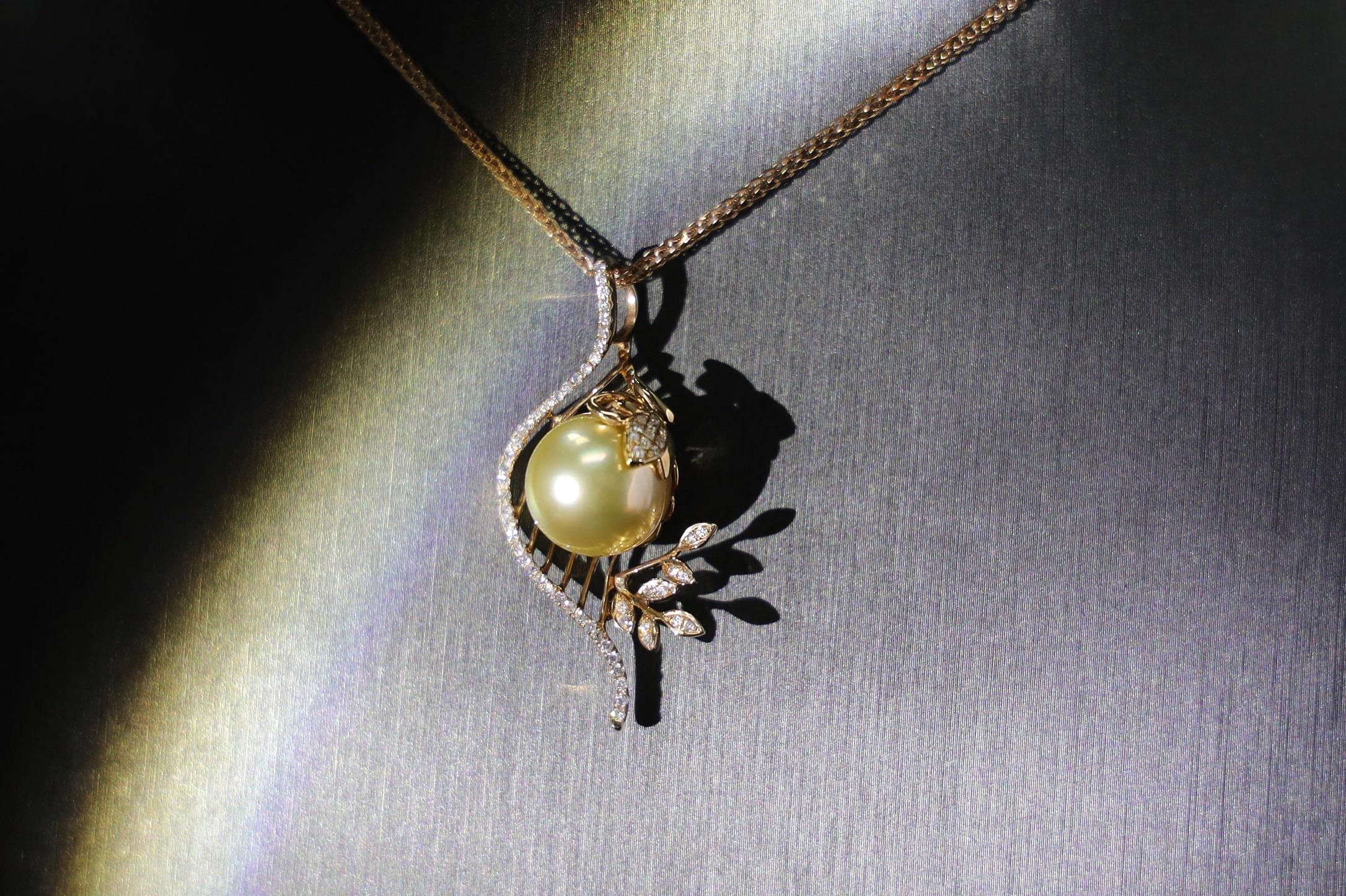 18K Yellow Gold Golden Pearl & Diamond Harp Pendant

64 Diamonds - 0.32 CT
Golden Pearl - 12 MM
Total Weight - 5.78 GM

Crafted with the finest 18K yellow gold, this exquisite pendant is a harmonious symphony of purity and brilliance. The flawless