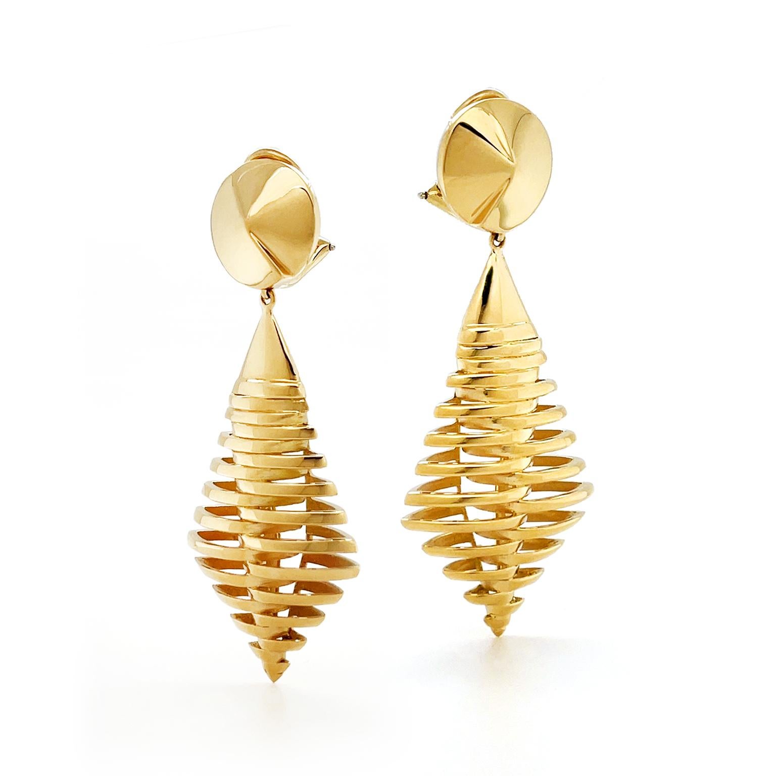 18k yellow gold glistens for a lantern design. Descending from a pointed circle, a narrow kite features slender gold bars wrapping around to form a lantern shape. Clip-backs secure the earrings, which measure 0.98 inches (width) by 2.44 inches
