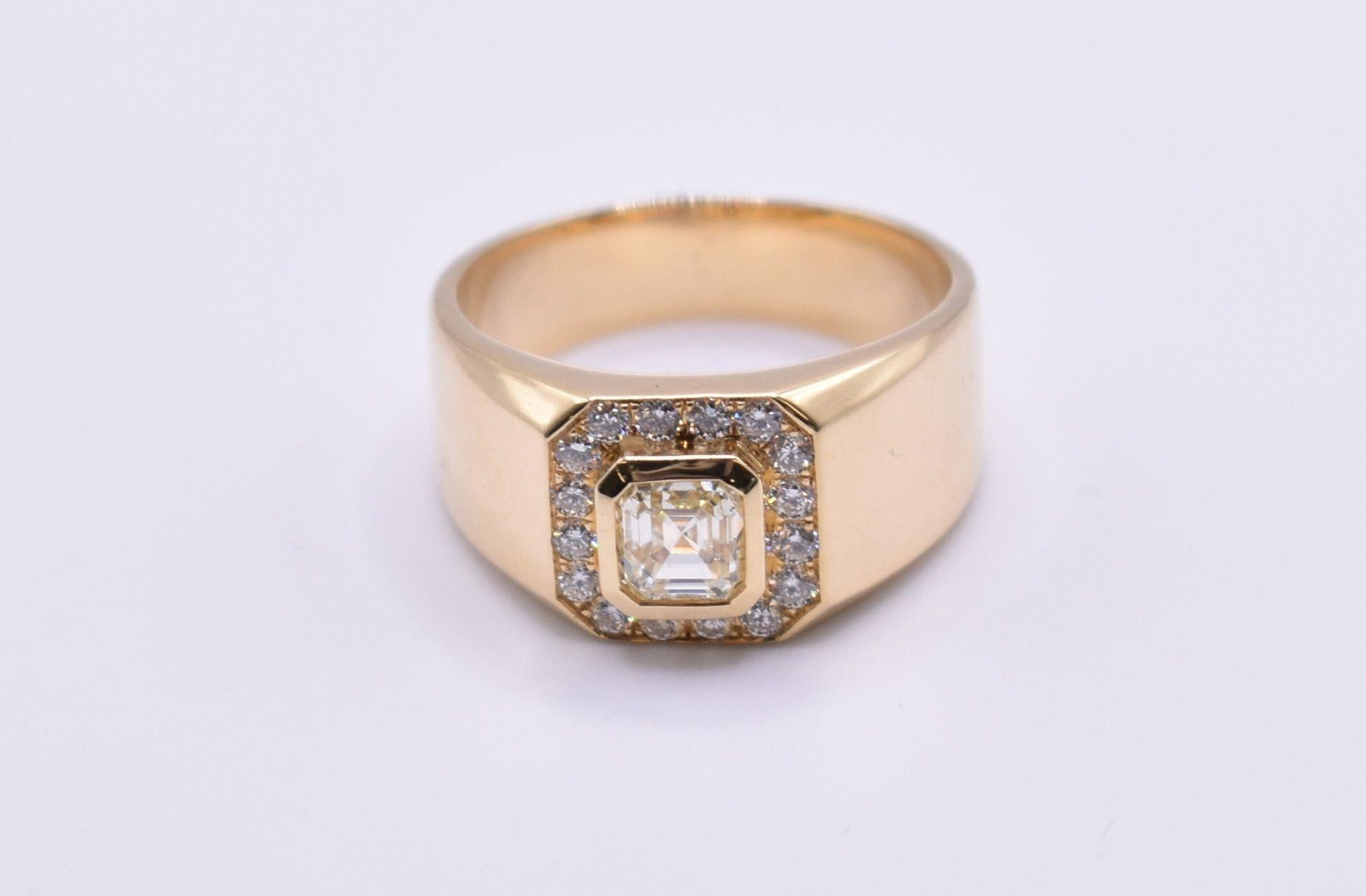 A wonderful 18k yellow gold square emerald cut diamond ring, having a 1.01ct emerald cut diamond to the centre, surrounded by small 0.29ct diamonds. K/L colour. Total weight: 10.5g

RRP: £5,995