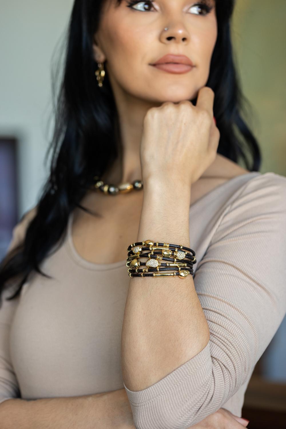 seven gold bracelets