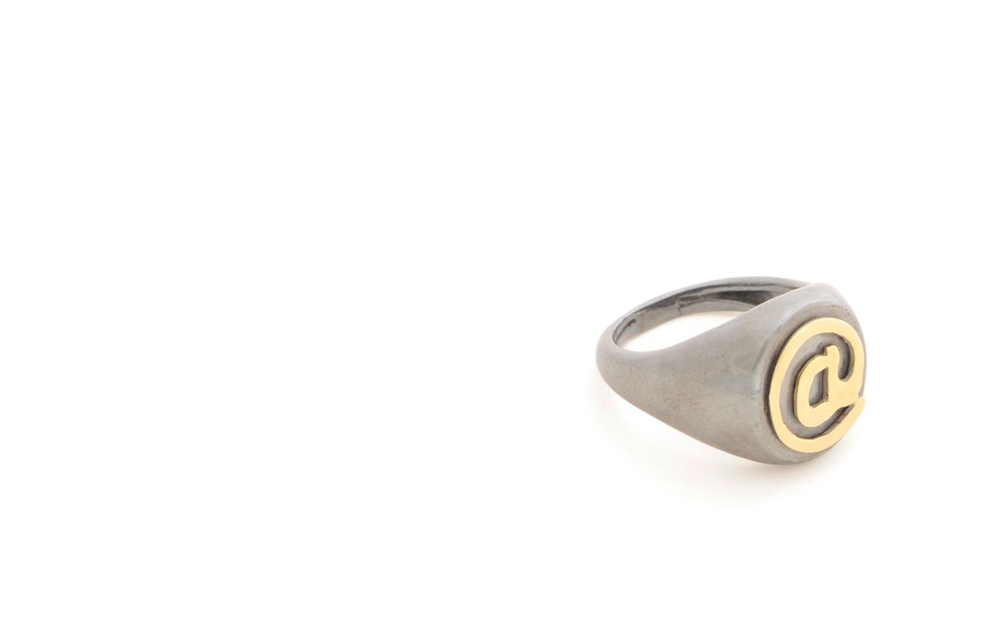 Rossella Ugolini Signet Ring Collection @ Contemporary Signet Ring.  Handcrafted @ made of 18K Yellow Gold crafted on Bold Silver Sterling Signet Ring.  The Shank is available in dark or grey burnish sterling silver. 
Signet Initial Rings are among