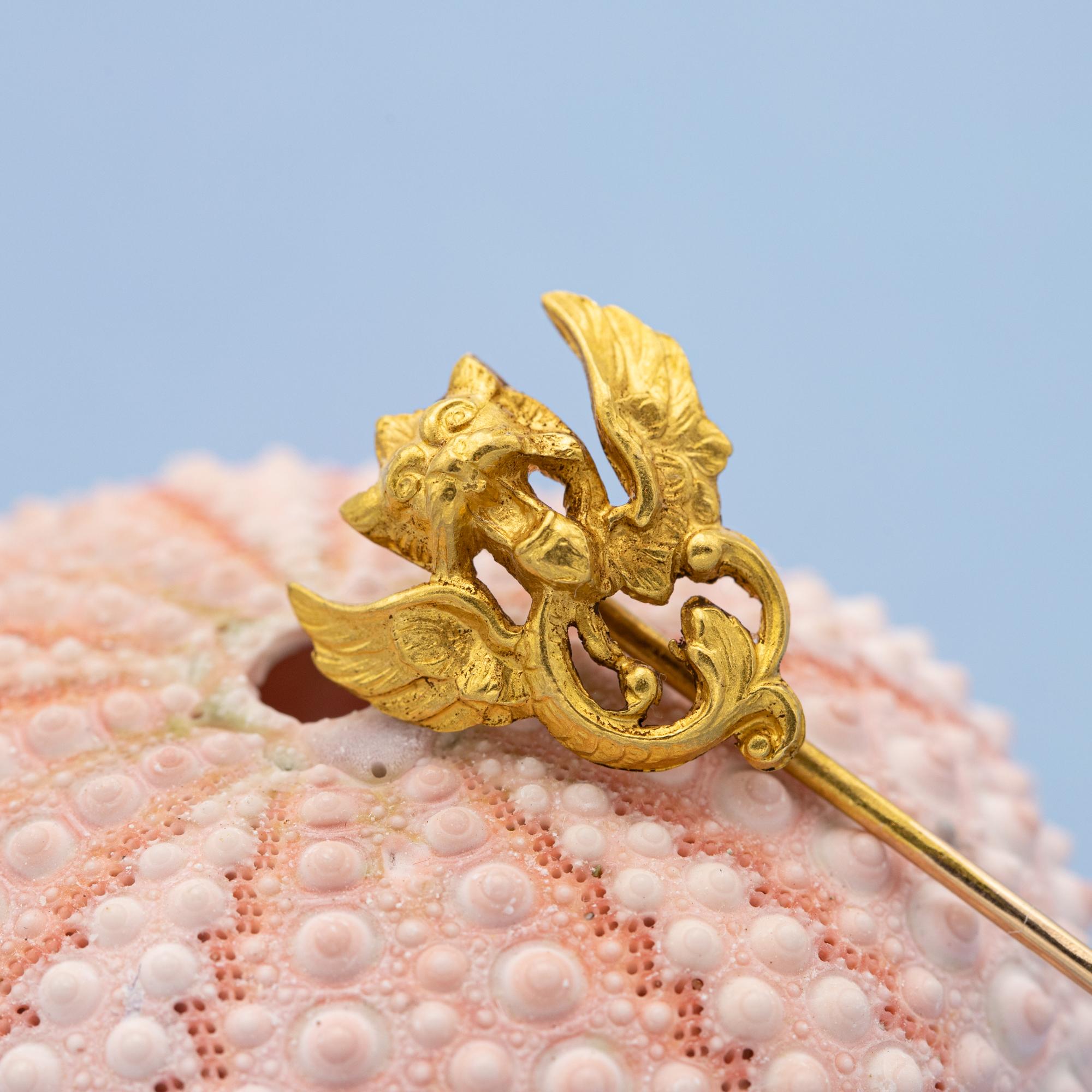 For sale is this stunning 18 carat gold Victorian dragon pin. This dragon / Eagle / Griffin is very detailed and breathtaking in real life. On top of that is this stickpin marked with a French eagle head. 

Queen Victoria, who reigned during the