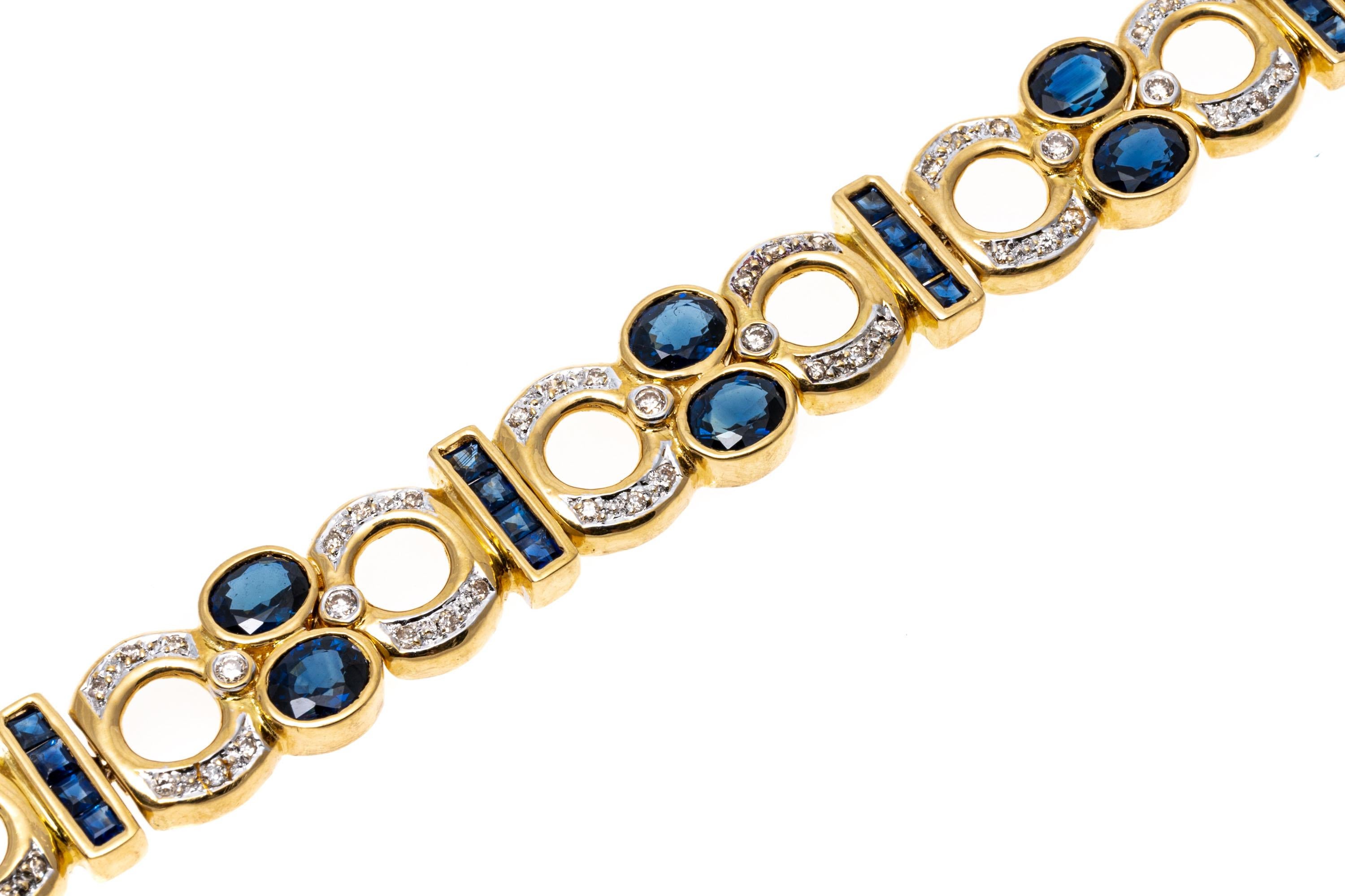 18k yellow gold bracelet. This striking bracelet features open round faceted diamond set links approximately 0.47 TCW. Alternating with the diamond links are vertical bars of calibre cut, channel set blue sapphires, approximately 1.68 TCW, which