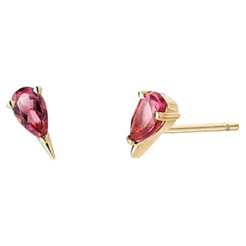 Stud earrings,  handcrafted in 18 Carat Yellow Gold and set with striking pear-shaped cherry-coloured tourmalines. These real gold earrings are perfect for individuals who enjoy building a personalized gold earring stack, allowing them to mix and