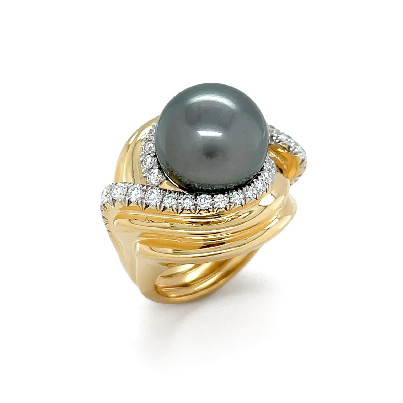 Beaming 18k yellow gold spirals around a single Tahitian pearl for this ring. The strand closest to the polychromatic pearl features pavé-set brilliant cut diamonds for added sparkle. As the metal continues to descend, it forms a multi-layered swirl