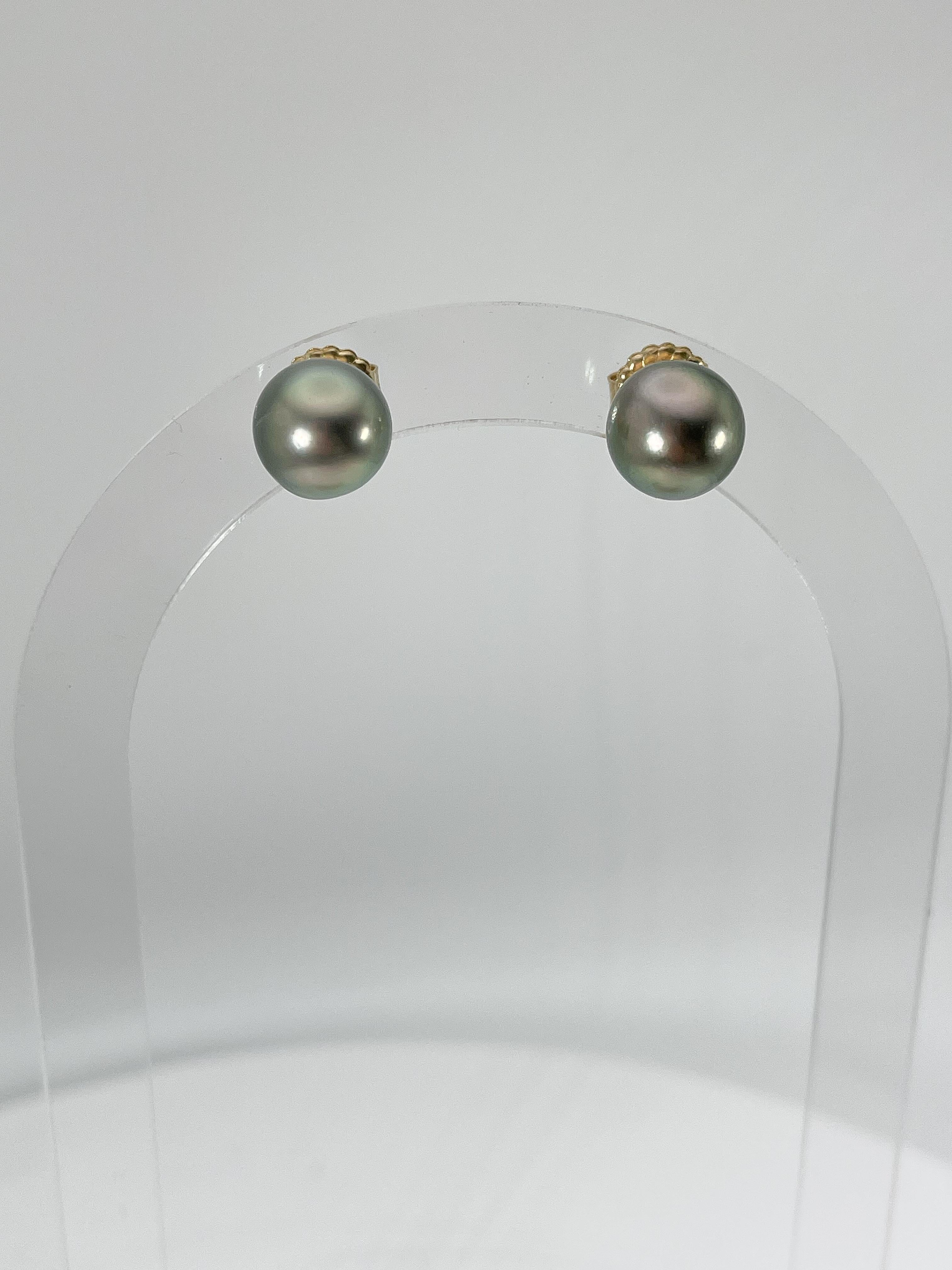 18k yellow gold Tahitian pearl studs. These earrings have a diameter of 11mm, and have a total weight of 4.3 grams.