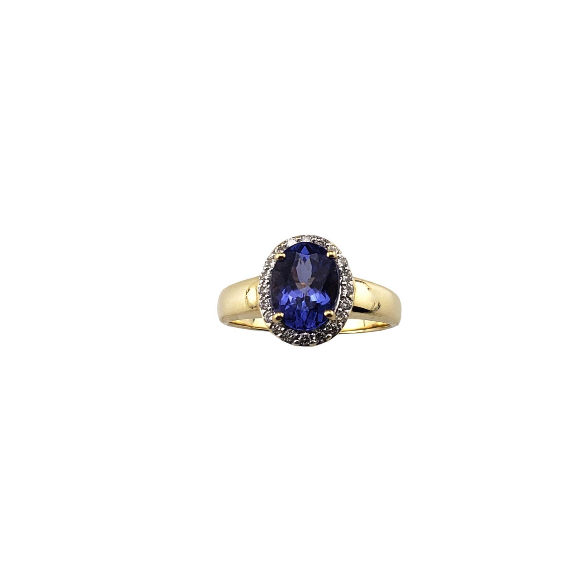 18 Karat Yellow Gold Tanzanite and Diamond Ring Size 7 JAGi Certified-

This stunning ring features one oval tanzanite (8.9 mm x 6.8 mm) surrounded by 20 round brilliant cut diamonds set in classic 18K yellow gold. Width: 12 mm. Shank: 2