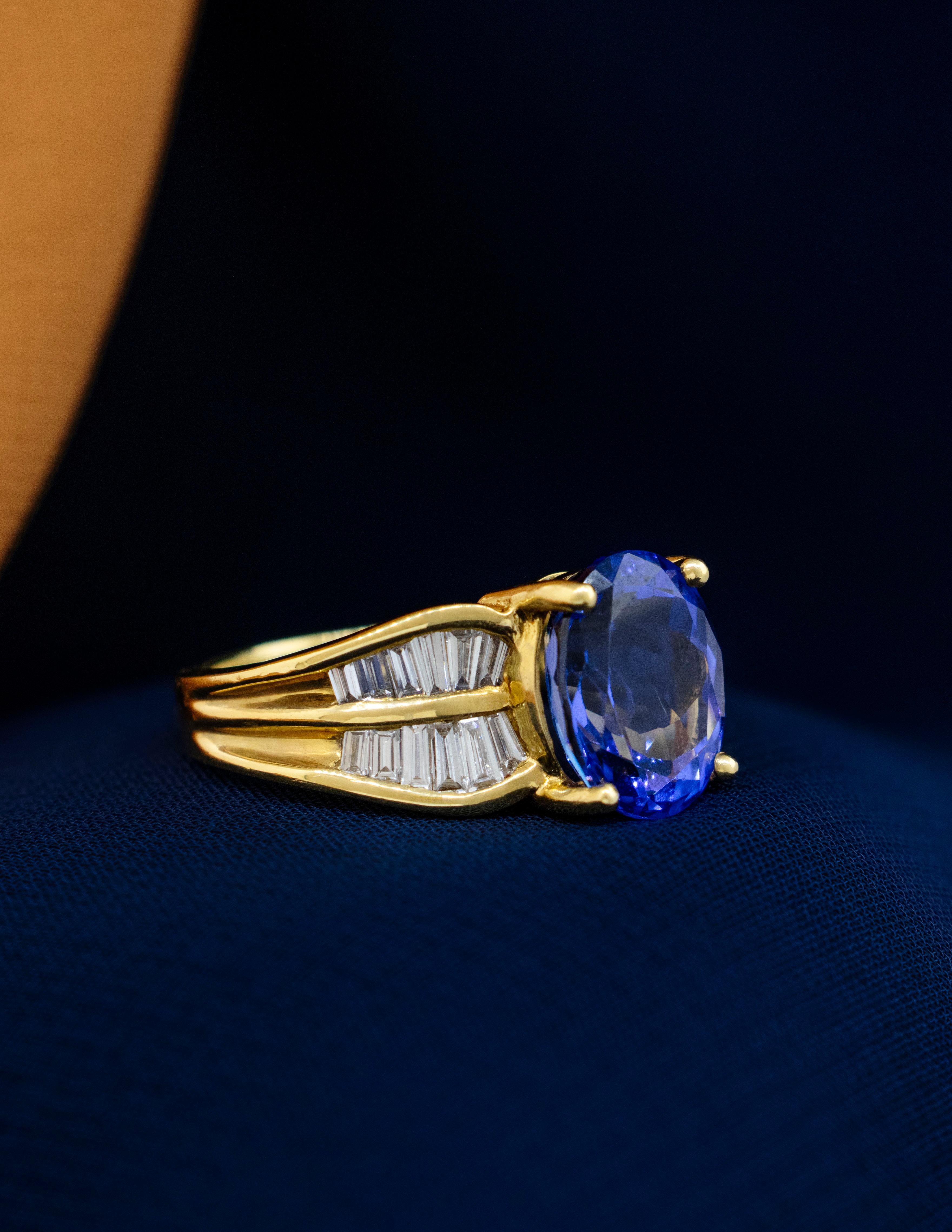 Oval Cut 18K Yellow Gold Tanzanite Ring with Baguette Diamonds For Sale
