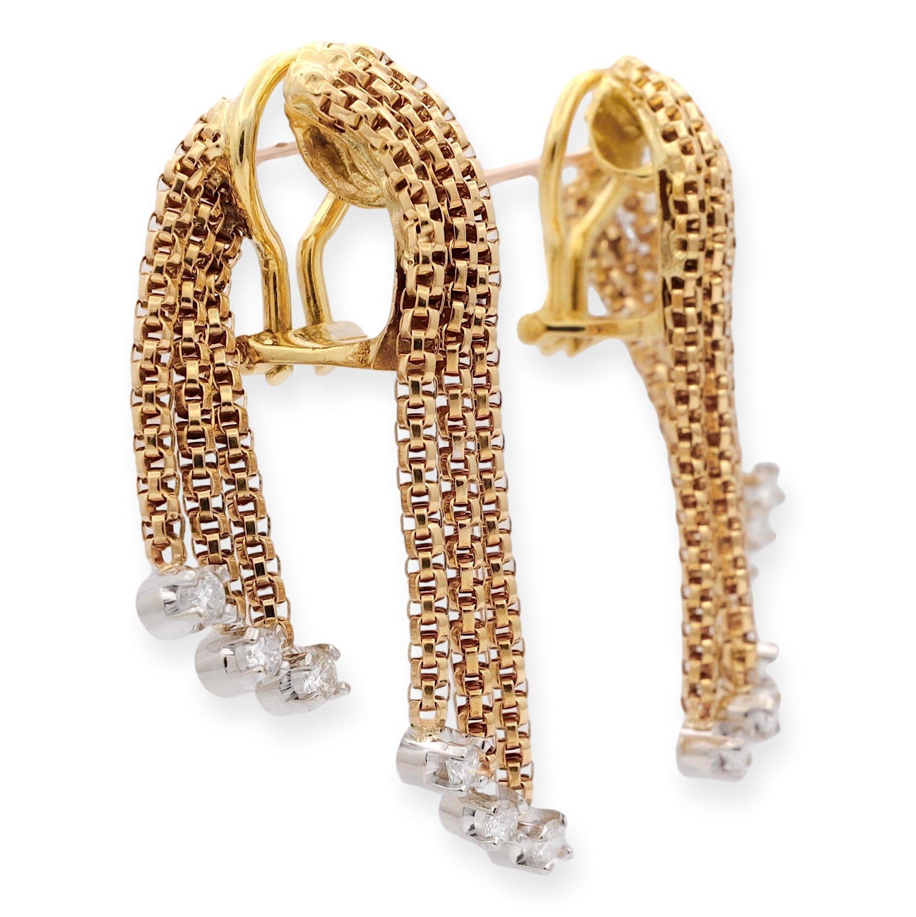 Vintage Drop Earrings, a testament to Italian craftsmanship. Finely crafted in 18 karat yellow gold, these gems feature a dozen round brilliant cut diamonds set in white gold prongs weighing a total of 0.60 carats approximately H-I in color and fine