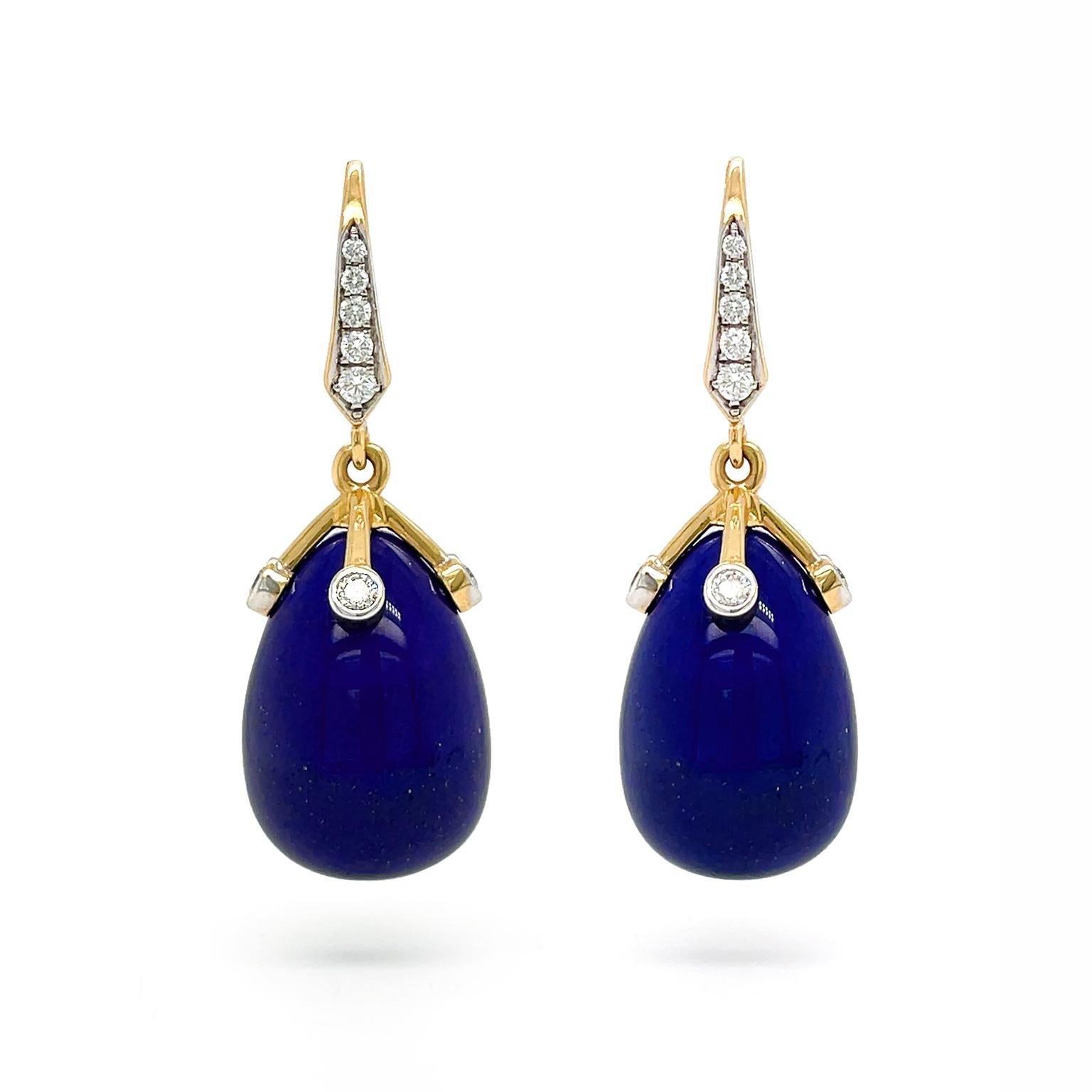 The deep indigo lapis lazuli is amplified by 18k yellow gold and brilliant cut diamonds. An 18k yellow gold lever back sparkle with an ascending row of brilliant cut diamonds. Suspending beneath is an 18k yellow gold cap with four extending arms,