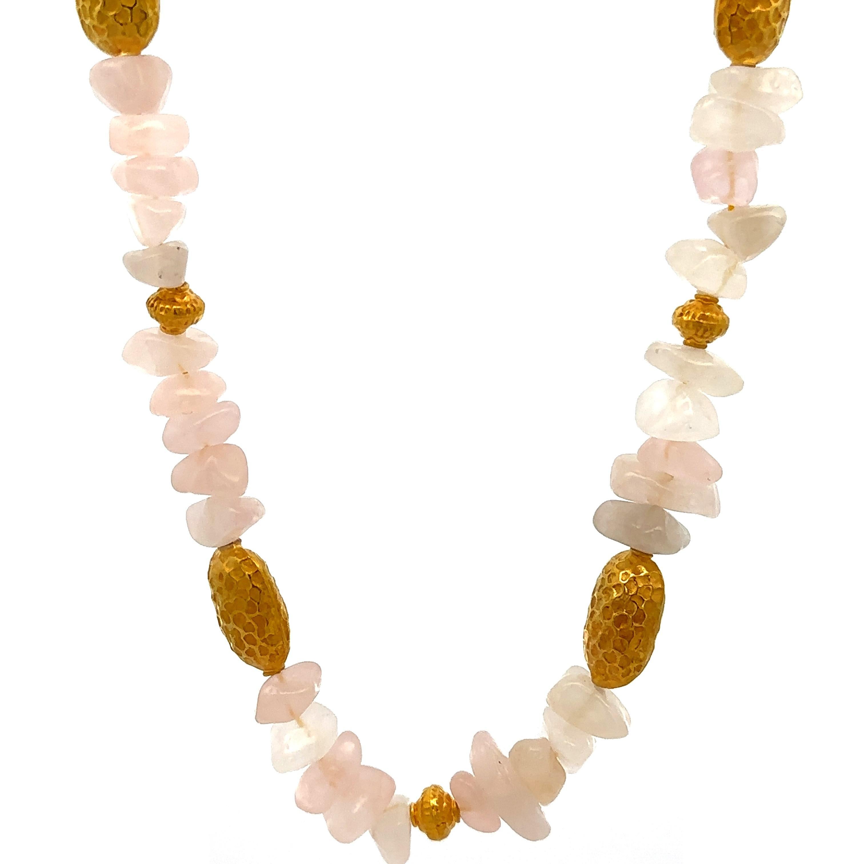 --Stone(s):--
(56) Natural Genuine Quartz - Tumble Beads - Strung - Rose/Pink Color

Material: String w/ Solid 18k Yellow Gold Beads & Clasp
Weight: 49.43 Grams (gross)
Chain Type: Quartz Tumble Beads w/ Gold Textured Beads Stations & Clasp
Chain