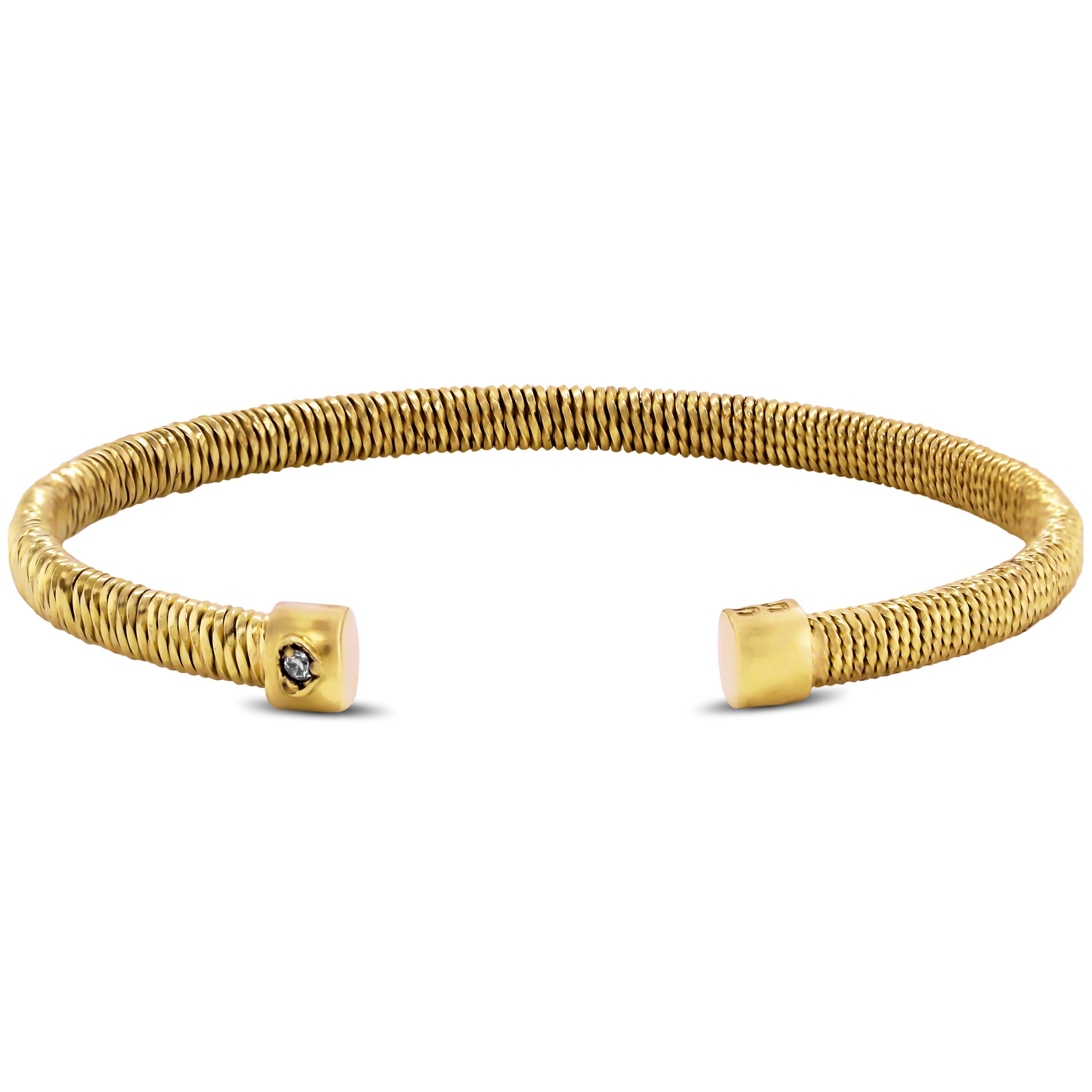 18K Yellow Gold Thin Bangle Bracelet by Stambolian

This bracelet features high-polshed, woven-like textured gold that makes up the bracelet entirely

Bracelet is a size 7. 5mm width

Signed Stambolian and has the Trademark 