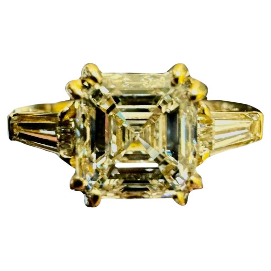 18K Yellow Gold Three Stone GIA 2.77 Carat Asscher Cut Diamond Engagement Ring For Sale