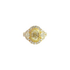 18K Yellow Gold Three-Stone Oval Diamond Ring with Fancy Yellow Accents
