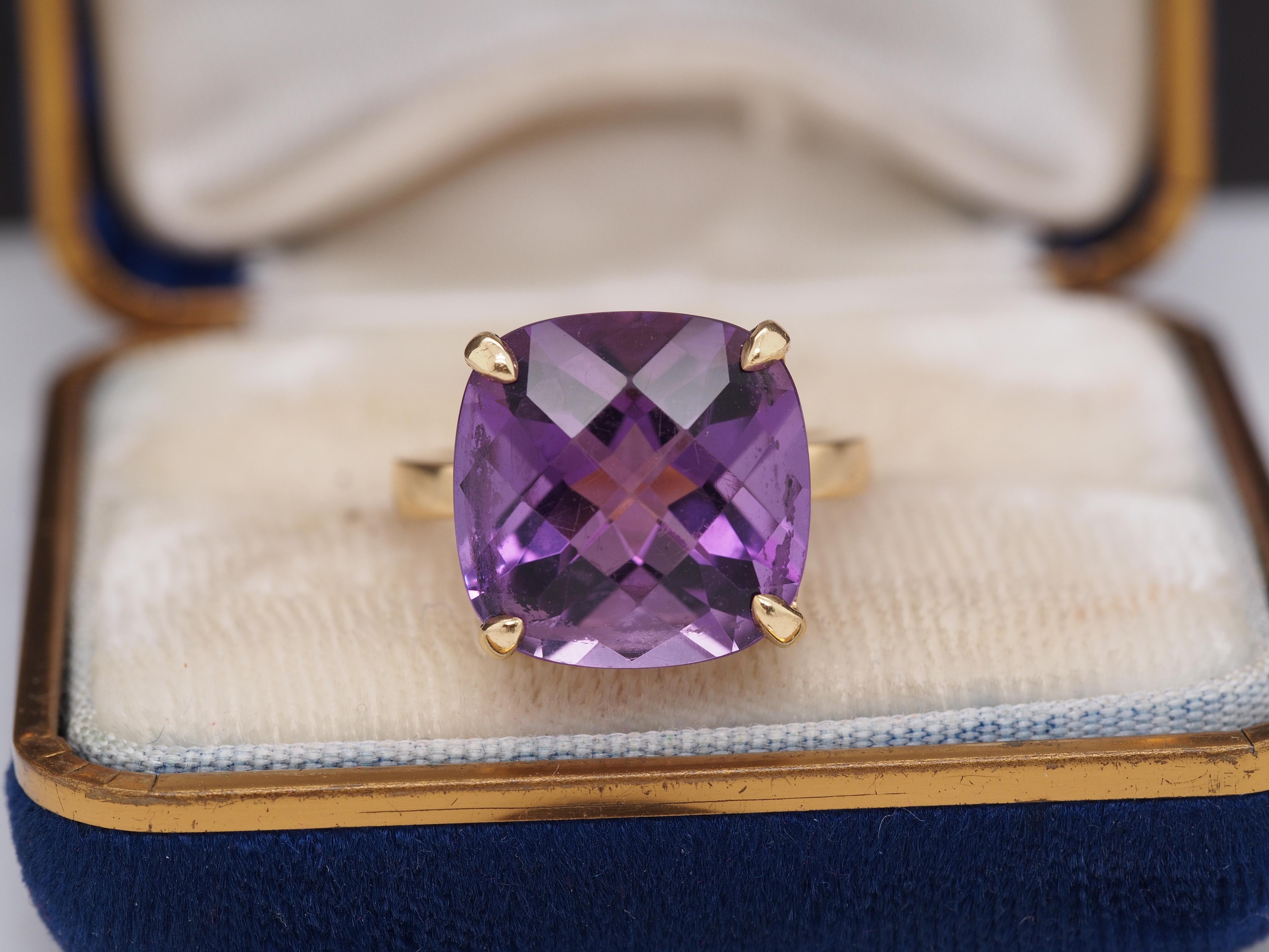 Year: 2000s
Item Details:
Ring Size: 6.25
Metal Type: 18K Yellow Gold [Hallmarked, and Tested]
Weight: 7.5 grams
Center Amethyst: 14mm x 14mm, Purple Amethyst
Band Width: 2.5mm
Condition: Excellent